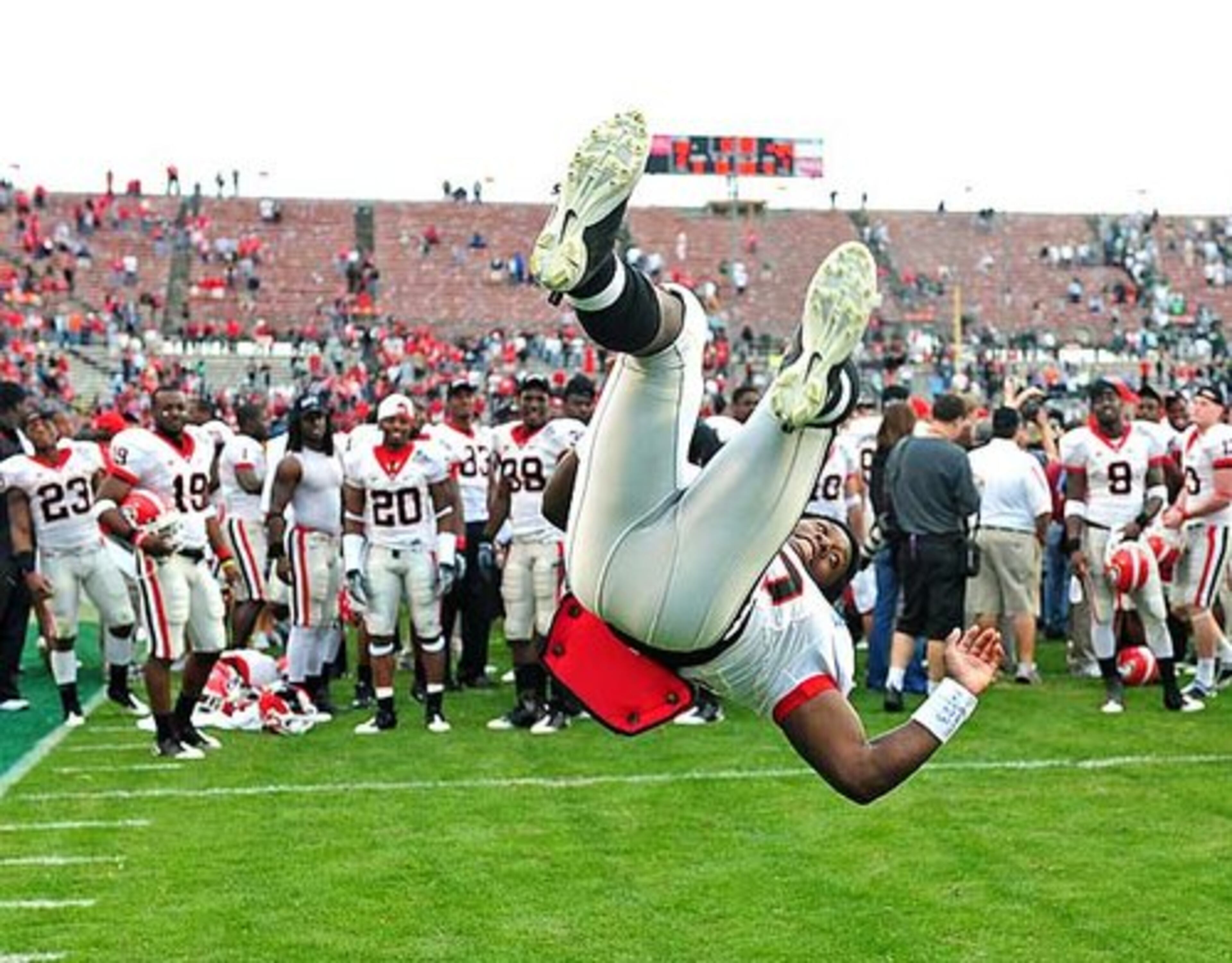 Georgia running back Carlton Thomas (30) does a backflip following Georgia's 24-12 victory over MIchigan State.