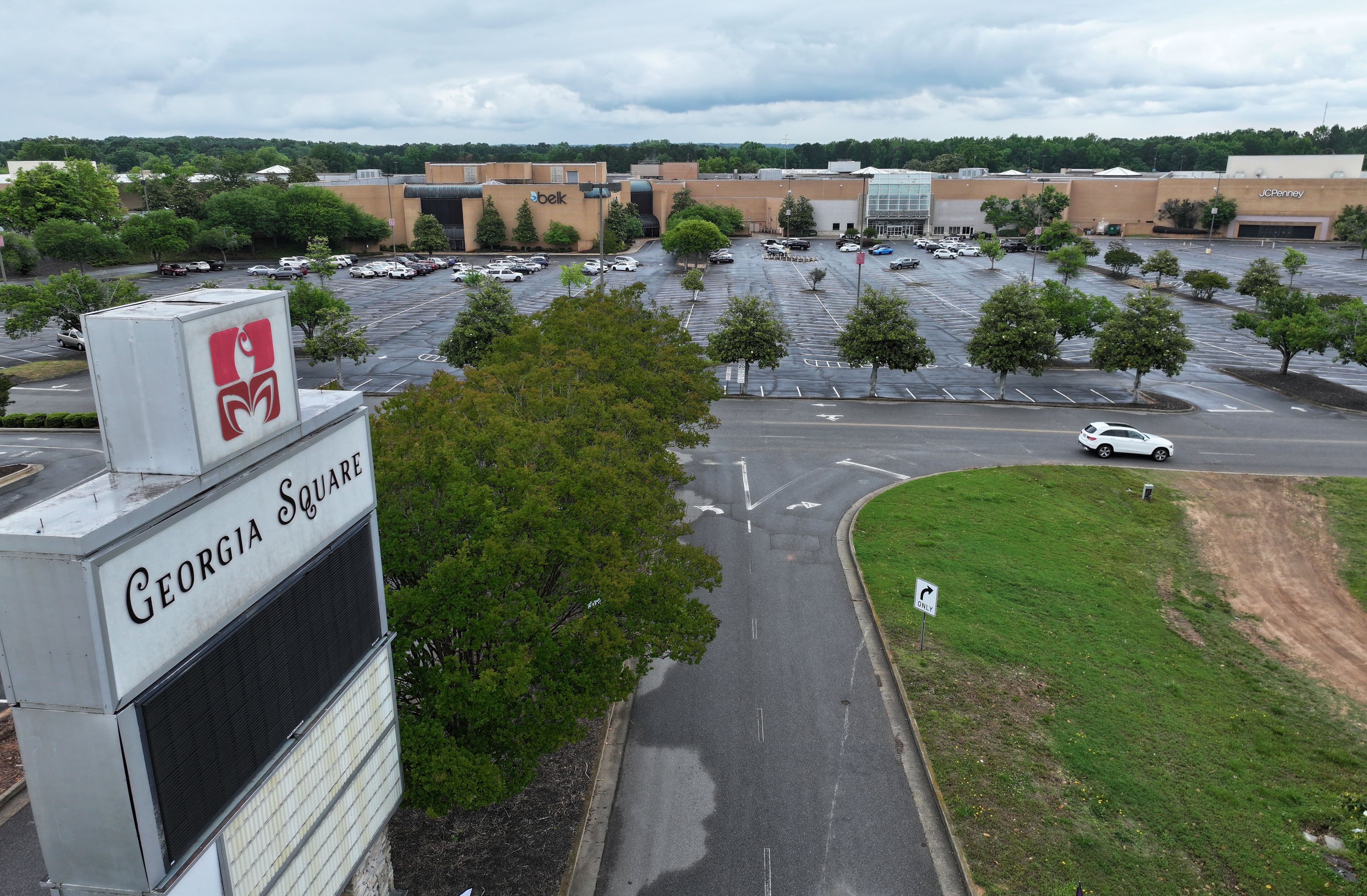 An aerial photo shows Georgia Square Mall in Athens in May 2025, with Belk visible in the distance. (Hyosub Shin/AJC)