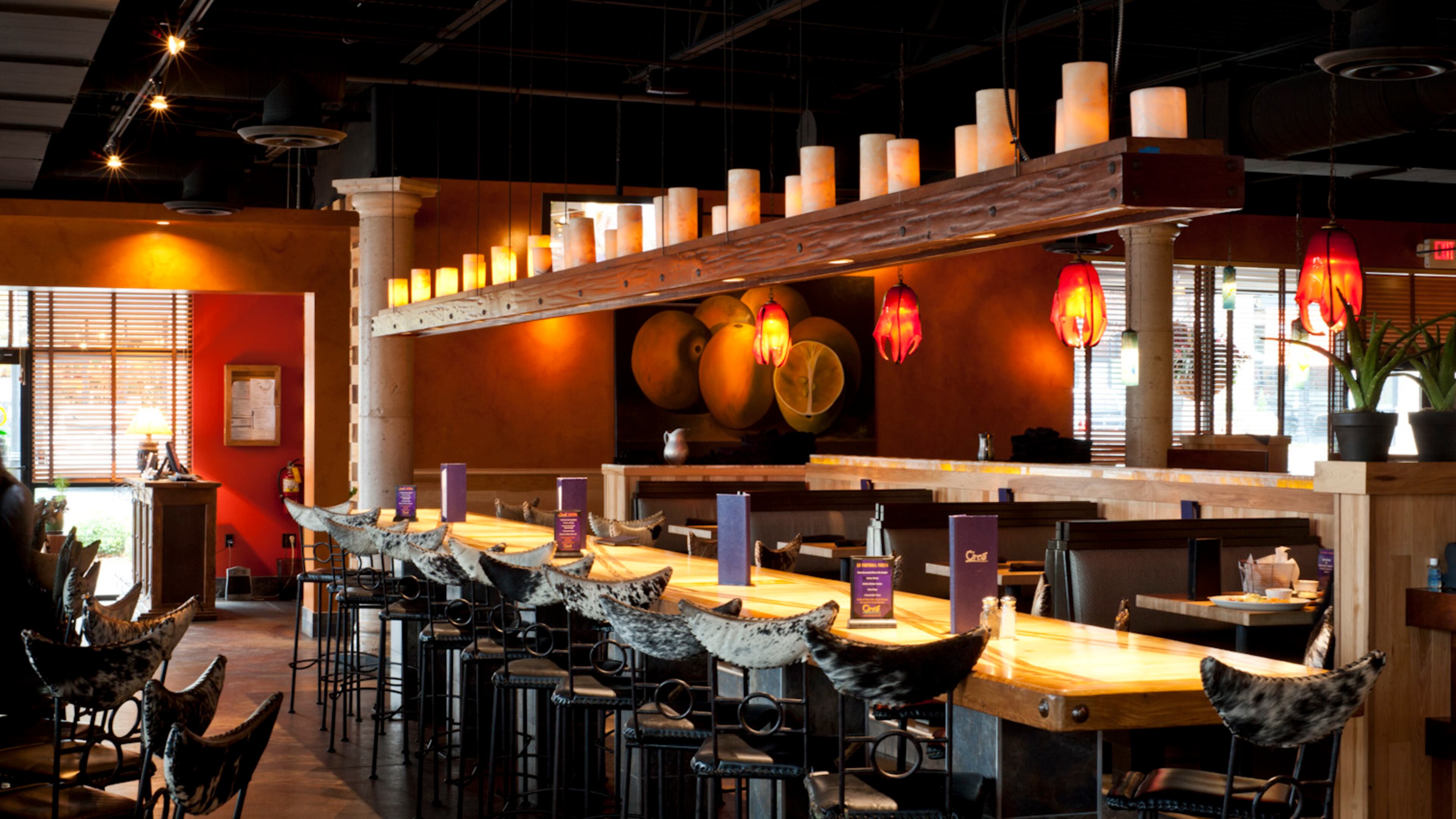 Cinco Mexican Cantina is opening a location at Perimeter Mall this fall. Like its sister restaurant in Suwanee (pictured), the newest Cinco will feature a long communal table. Photo by Todd Burandt.