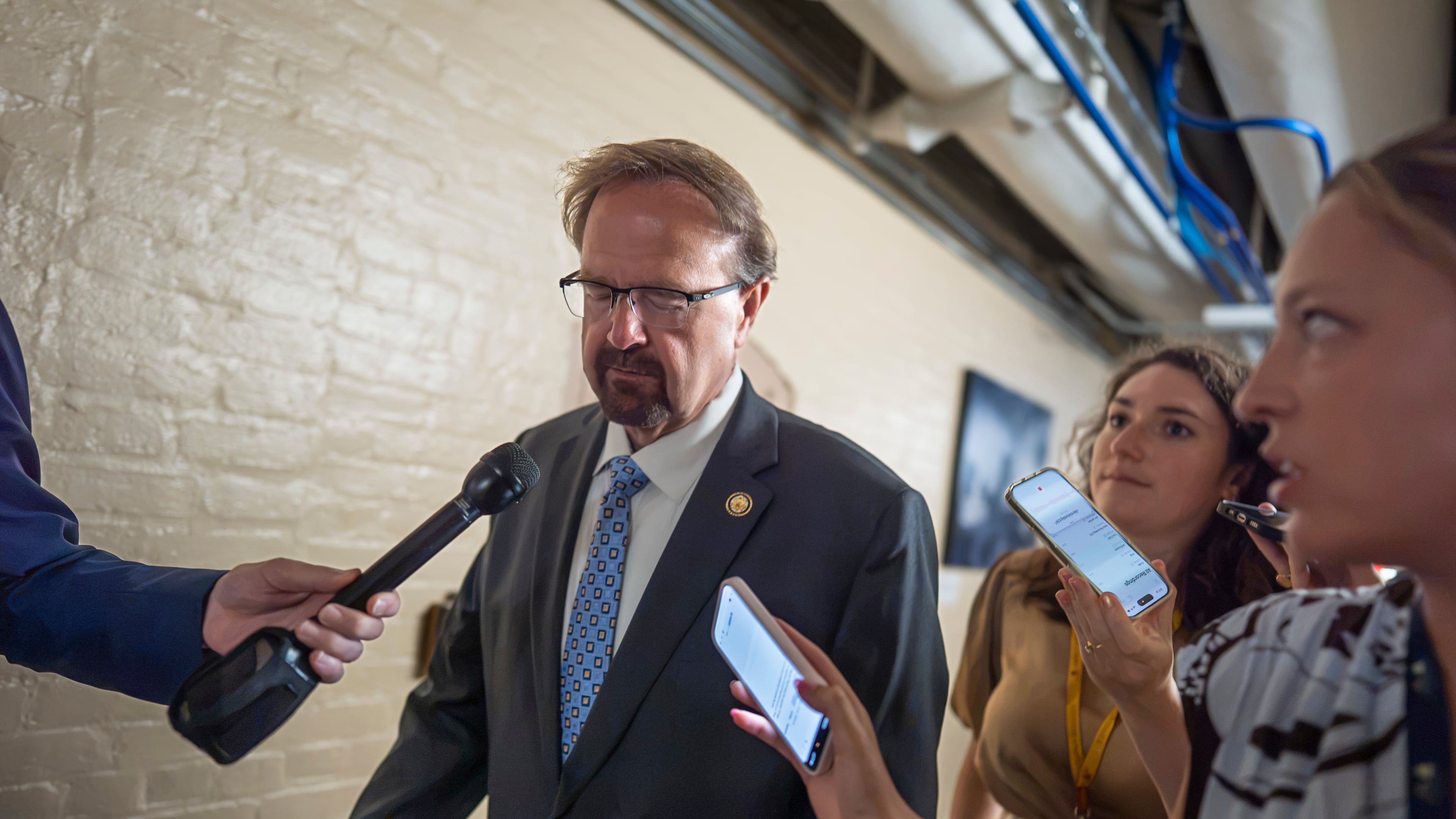 Rep. Chuck Edwards, R-N.C., who is under threat of censure, is met by reporters as he walks to a closed-door meeting with Republican lawmakers at the Capitol in Washington, Tuesday, Sept. 1, 2026. (AP Photo/J. Scott Applewhite)