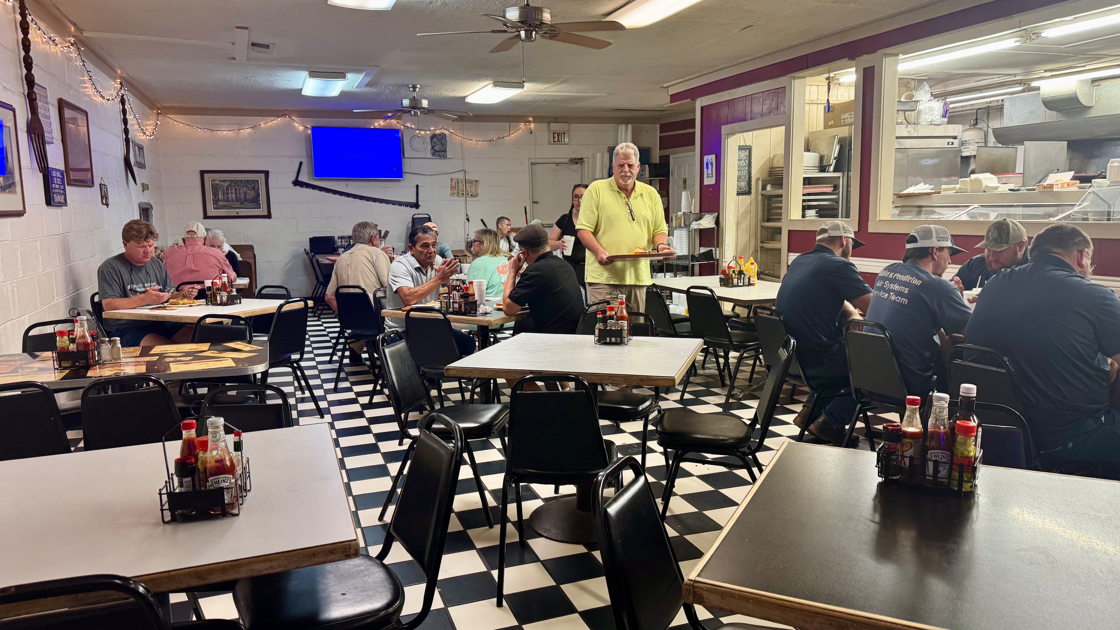 The dining room at Cox Cafe in Macon, a meat-and-three staple in the city's industrial district. (Joe Kovac Jr./AJC)