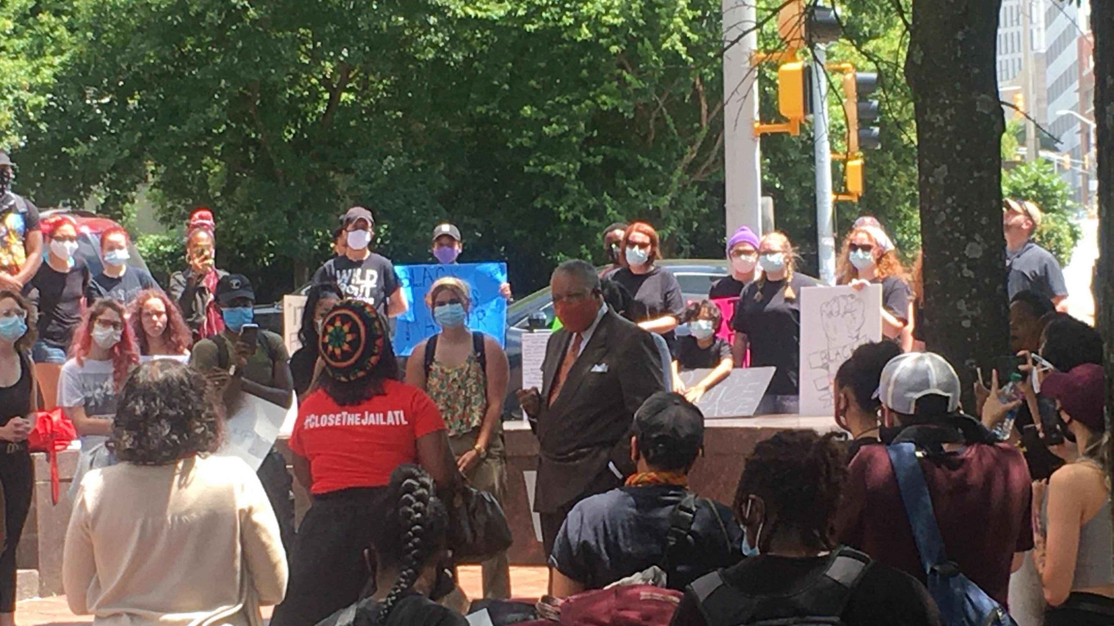 Fulton Commissioner Chairman Robb Pitts left an active Board of Commissioners meeting to speak with, according to a county spokesperson, roughly 40 people outside the county’s headquarters protesting against the proposal to spend $23 million to build a COVID-19 isolation unit at the Fulton jail. (Provided by Fulton County government)