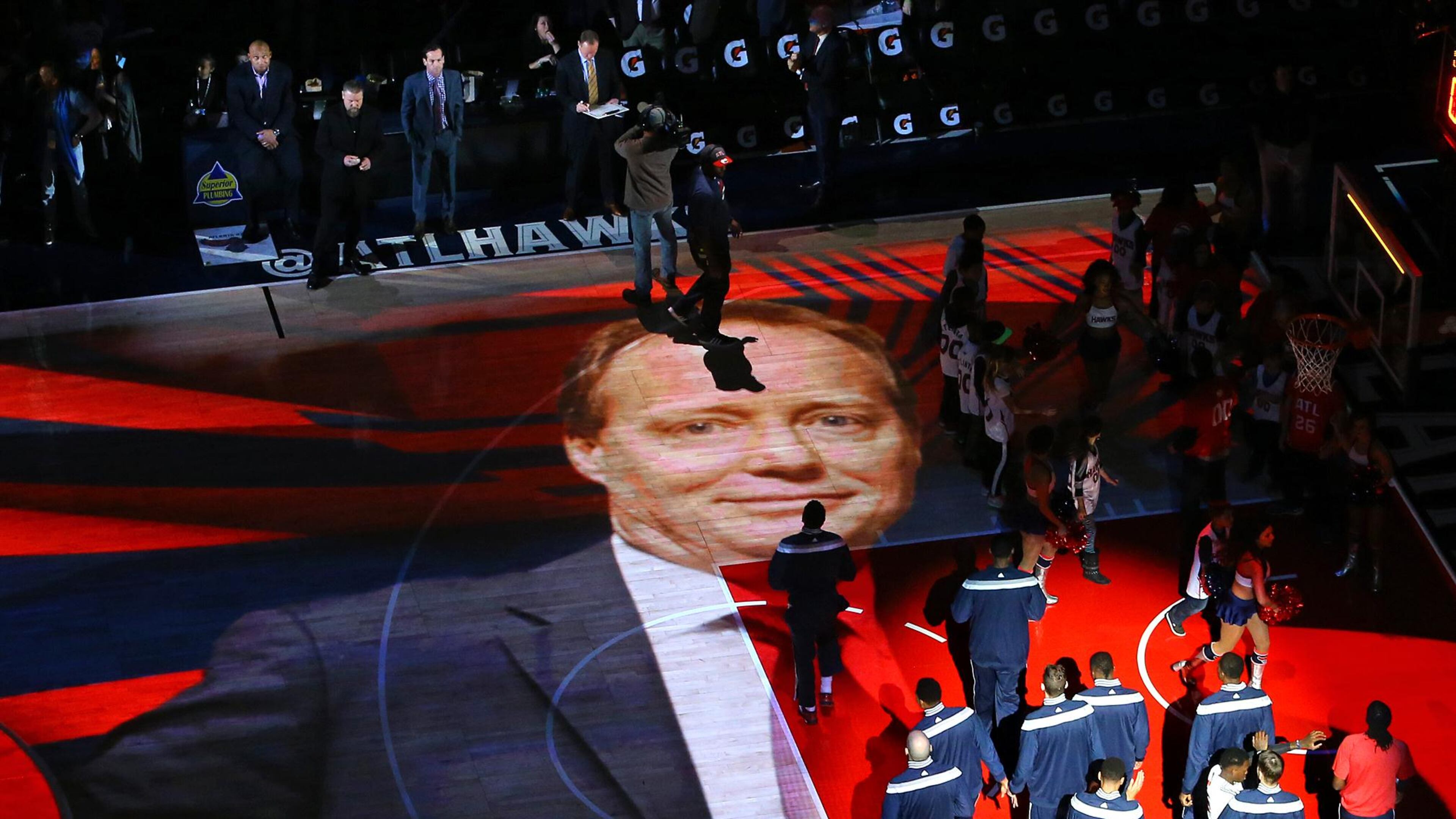 011115 ATLANTA: The image of Hawks head coach Mike Budenholzer is projected on the hardwood as the Hawks players and coaches take the floor to play the Wizards on their way to an eight straight victory during a basketball game on Sunday, Jan. 11, 2015, in Atlanta. The Hawks beat the Wizards 120-89. Curtis Compton / ccompton@ajc.com What does Mike Budenholzer, the Hawks' big picture guy, have planned? (Curtis Compton, AJC)