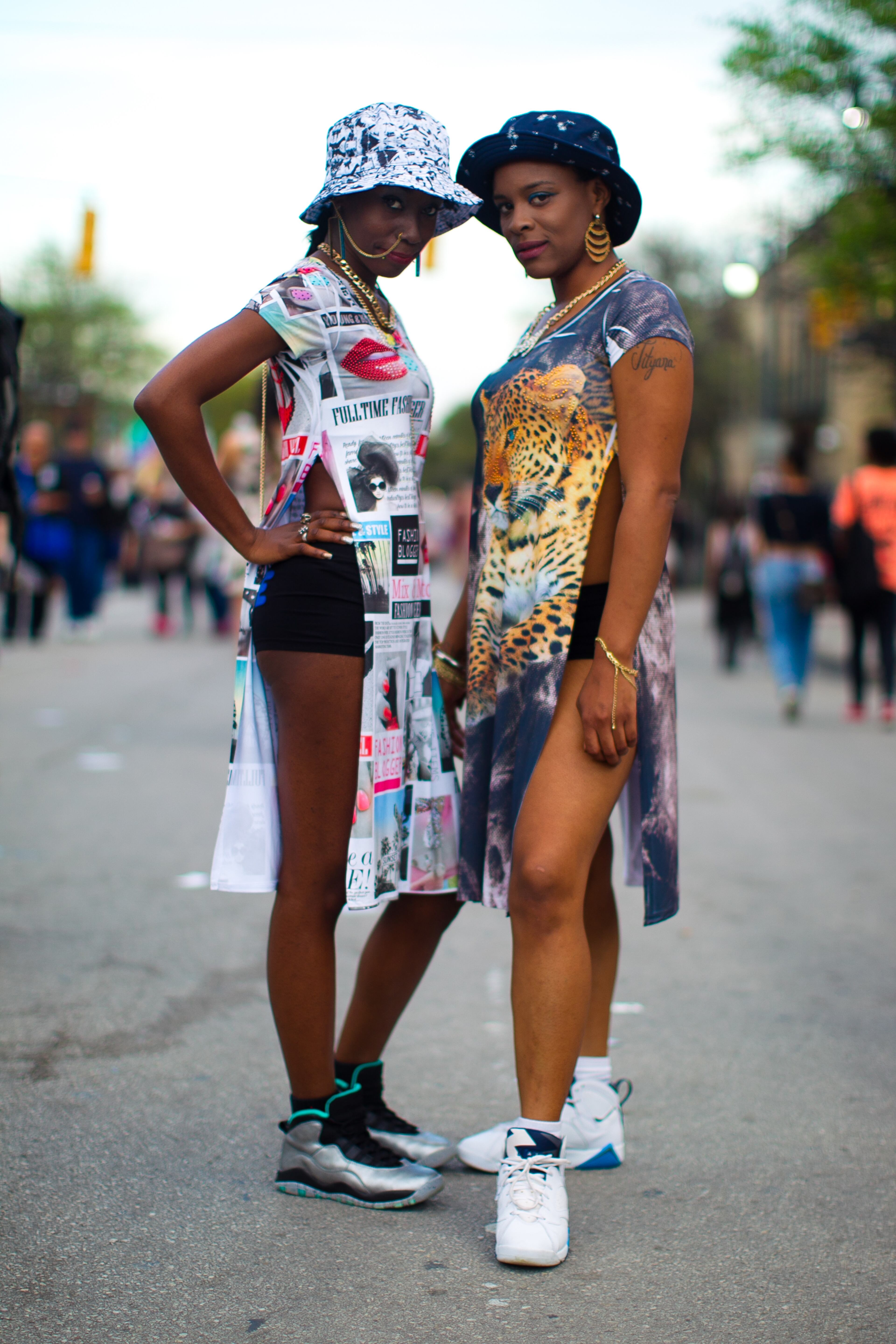 Emma Harris (left) and Katrice Shelton shows of their colorful SXSW outfits on East Sixth Street in Austin on Wednesday, March 18, 2015. Lukas Keapproth/AMERICAN-STATESMAN
