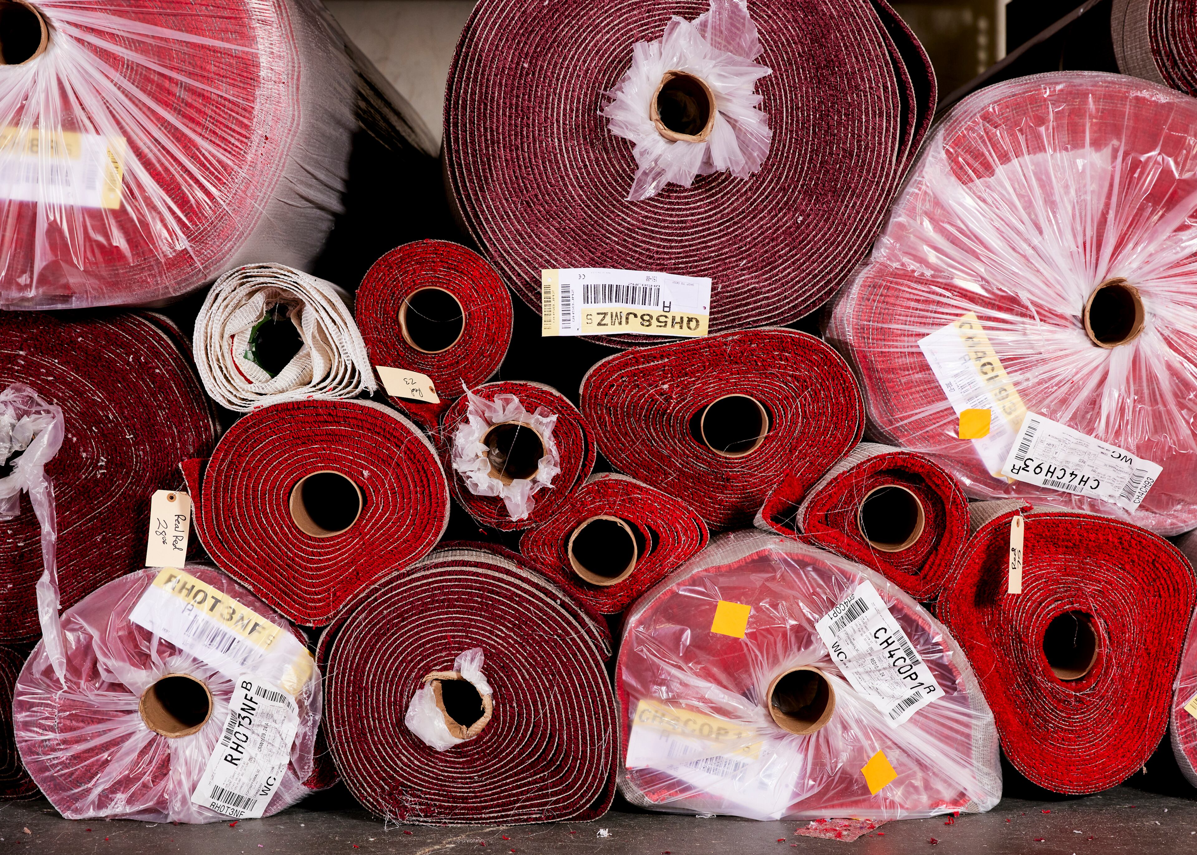 Rolls of the 2025 Oscars red carpet, in an exclusive shade known as Academy Red, arrived at a warehouse in La Mirada, Calif., on Feb. 21, 2025. Steve Olive, who has worked in the event carpet business for more than three decades, is the man the Academy trusts to get its iconic rug just right. (Jennelle Fong/The New York Times)