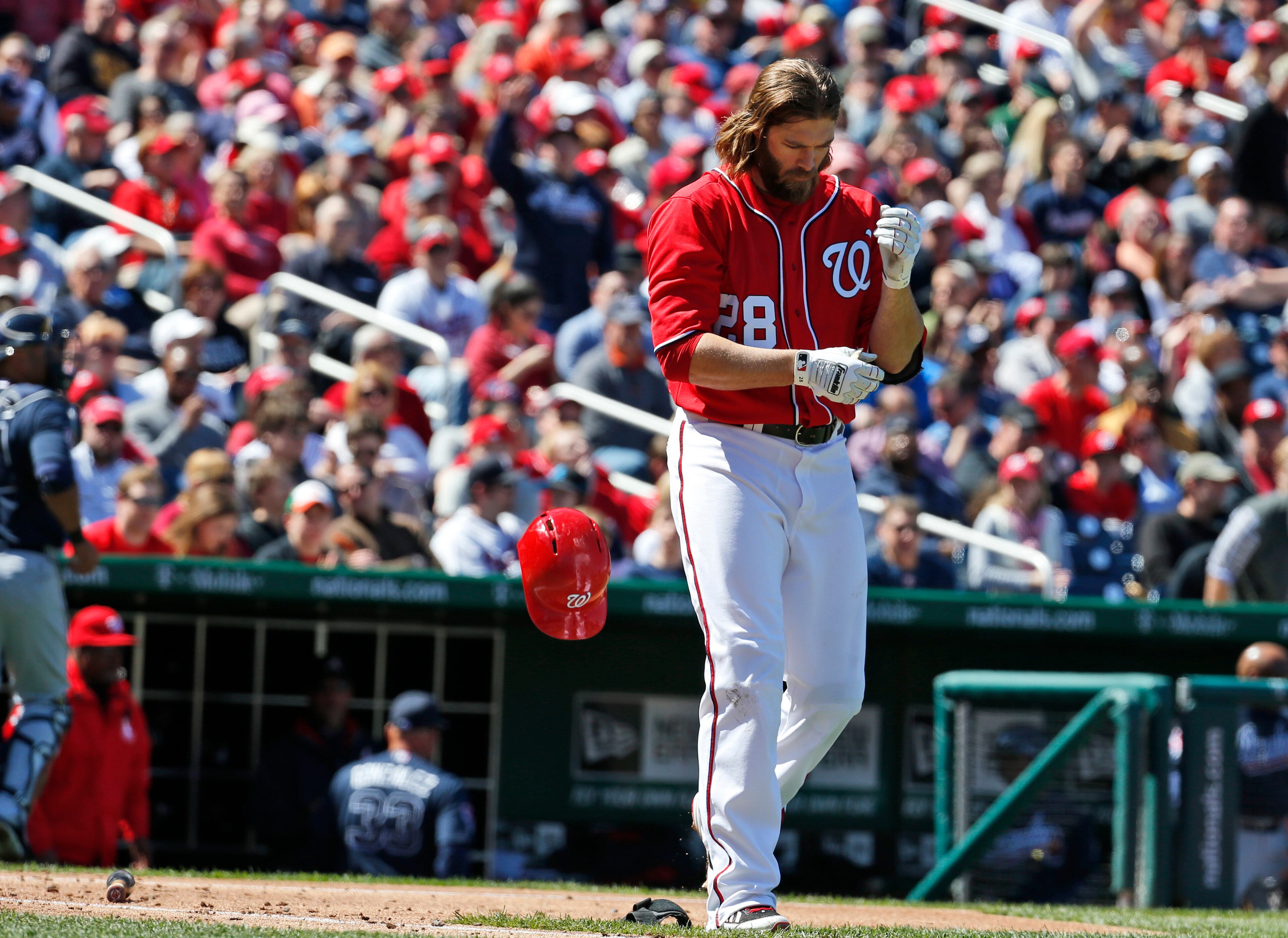 Washington Nationals' Jayson Werth drops his helmet after striking out during the third inning of a baseball game against the Atlanta Braves at Nationals Park, Sunday, April 6, 2014, in Washington. (AP Photo/Alex Brandon)