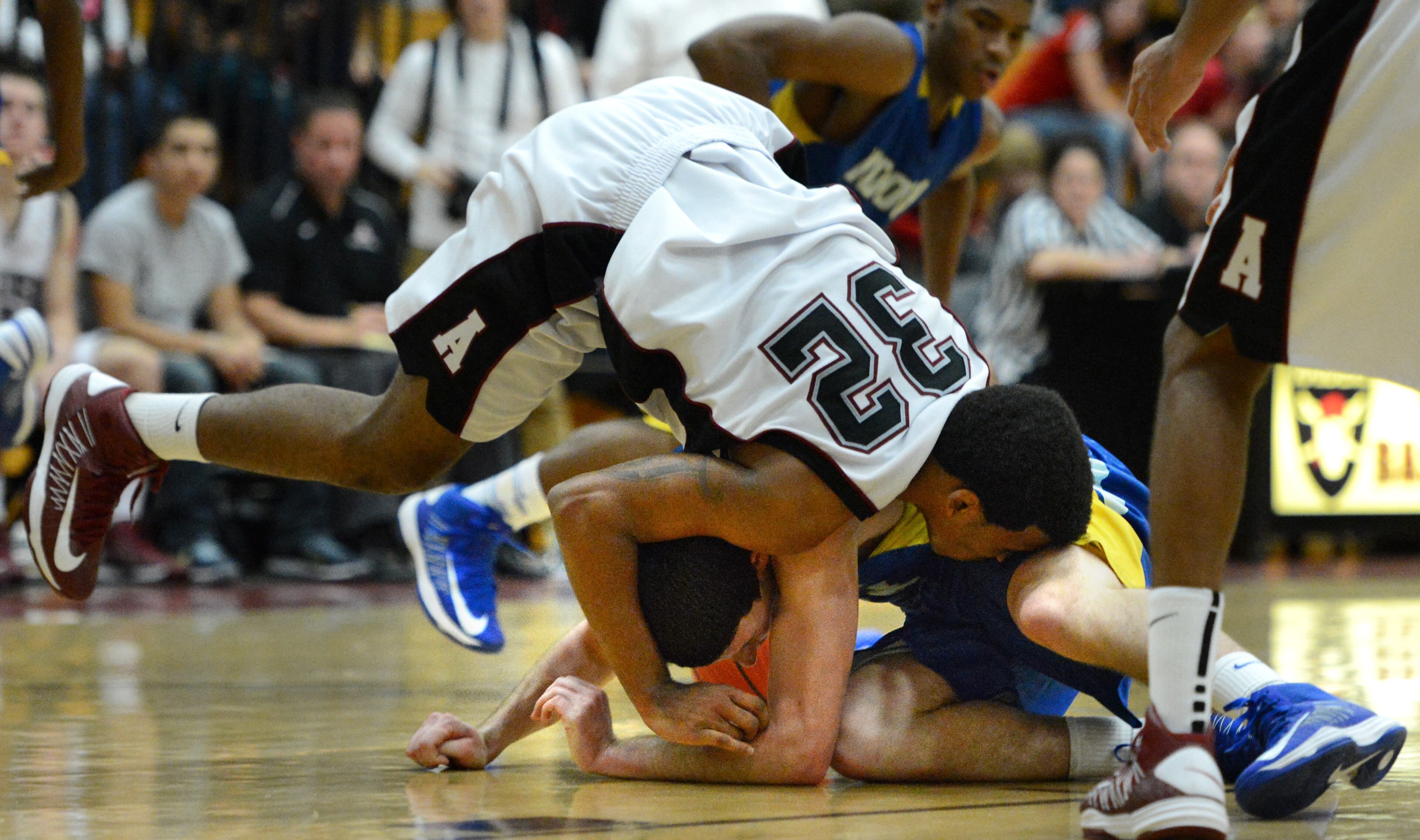 Alpharetta's Ty Toney (32) gets tangled with Chattahoochee's Ben Napoletan (12) in the second half.