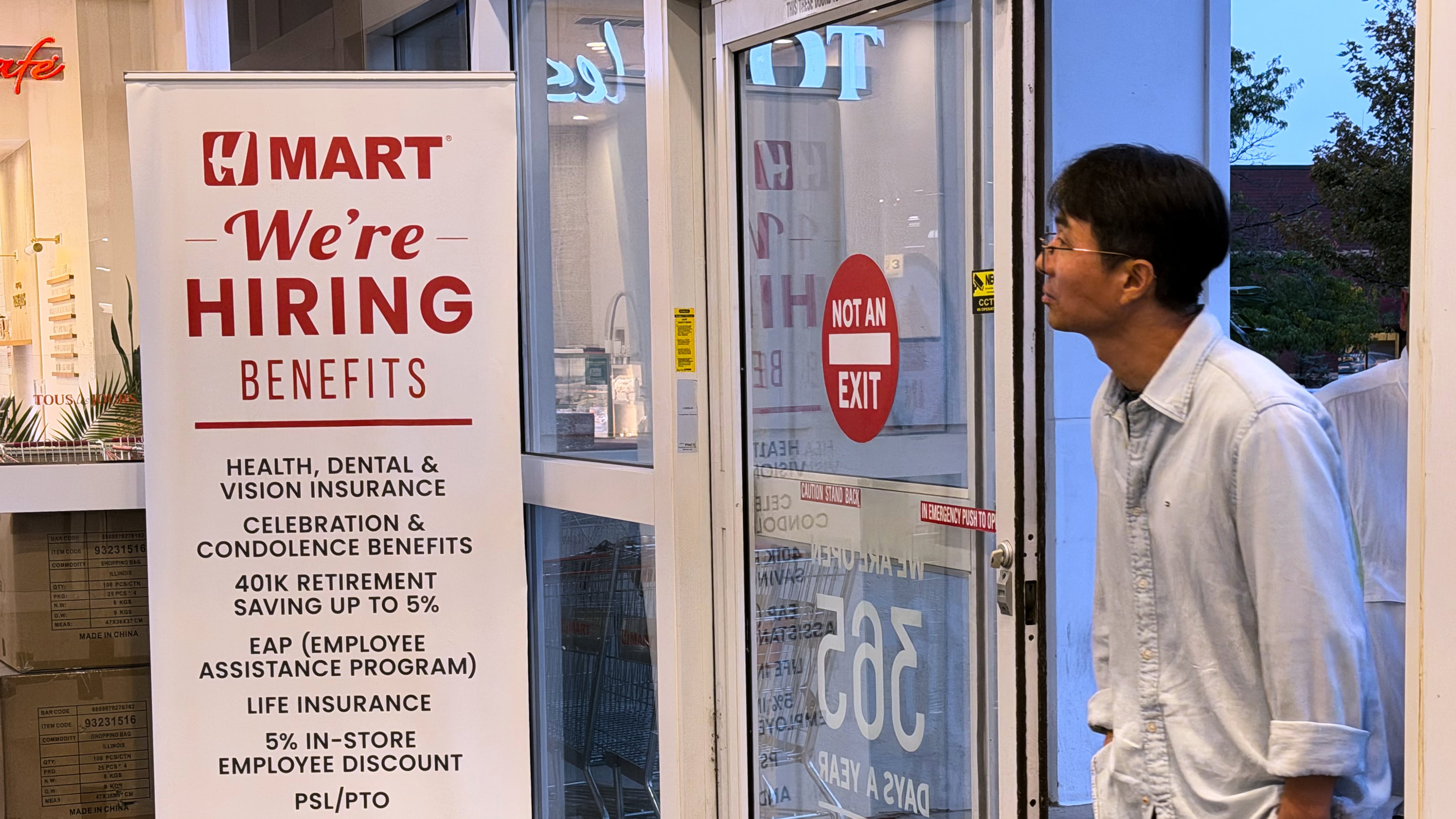 A hiring sign is displayed at a grocery store, in Schaumburg, Ill., Wednesday, Sept. 16, 2026. (AP Photo/Nam Y. Huh)