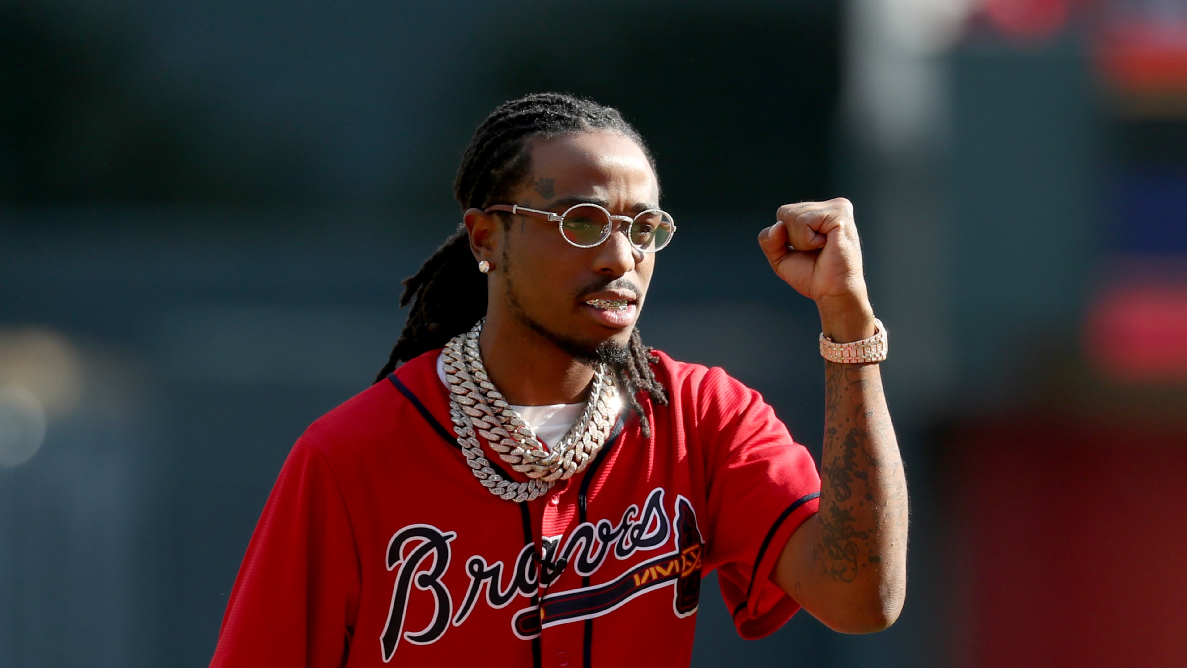 Quavo of Migos reacts after throwing out the ceremonial first pitch. (JASON GETZ/SPECIAL TO THE AJC)
