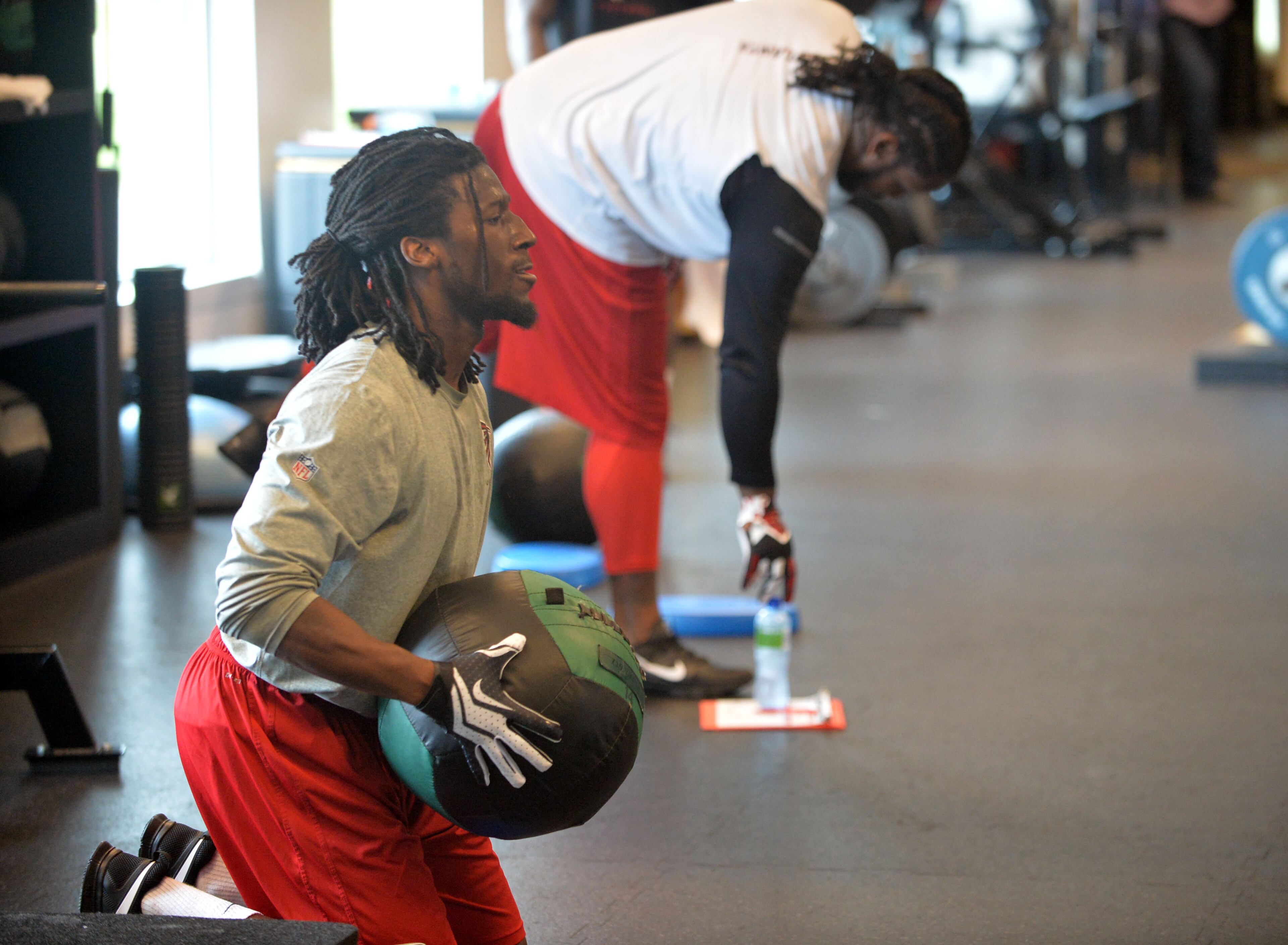 Falcons cornerback Desmond Trufant works with a medicine ball at the team's headquarters in Flowery Branch on Tuesday, April 22, 2014.