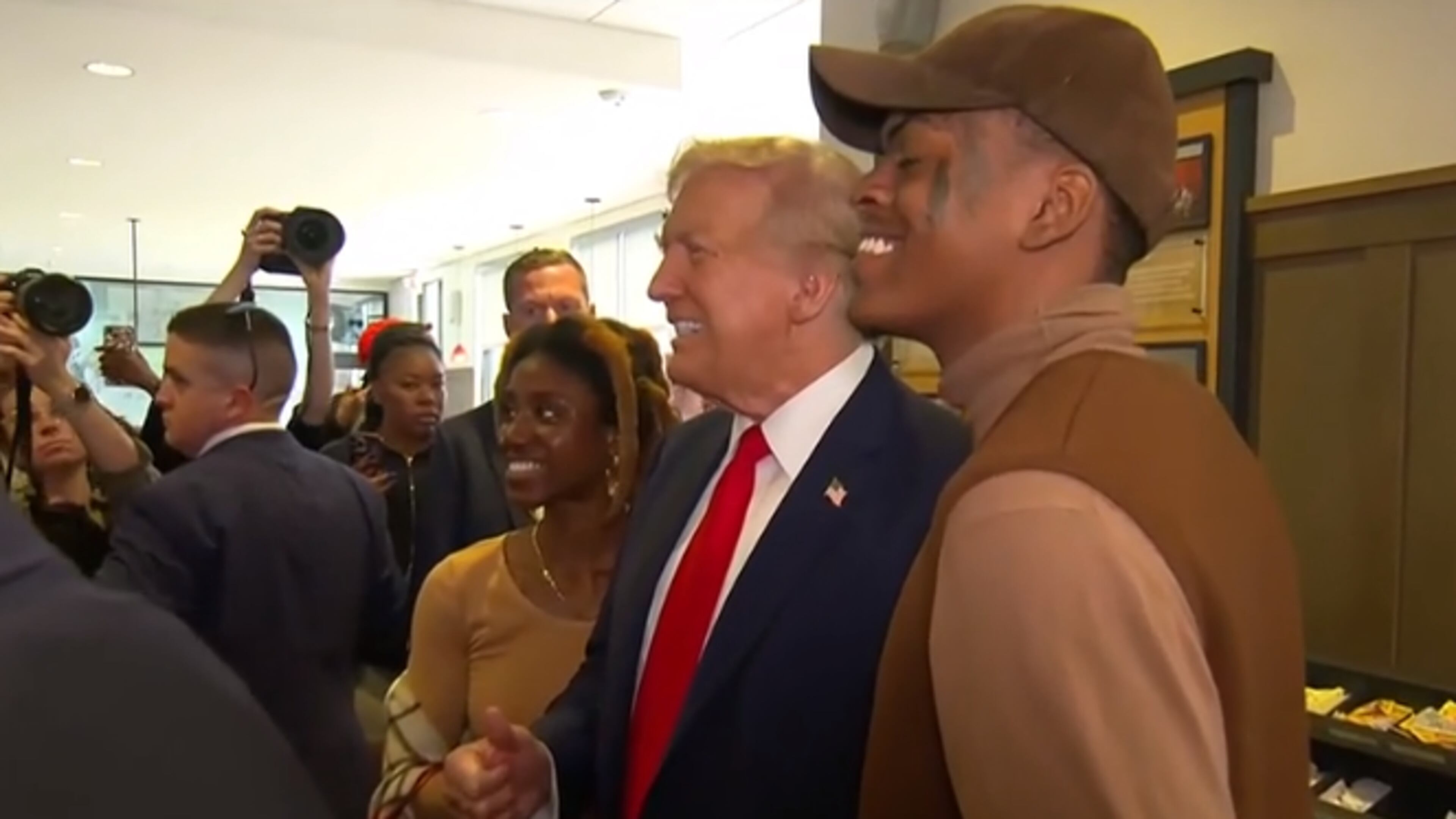Former President Donald Trump meets customers at a Chick-fil-A while in Atlanta on Wednesday.