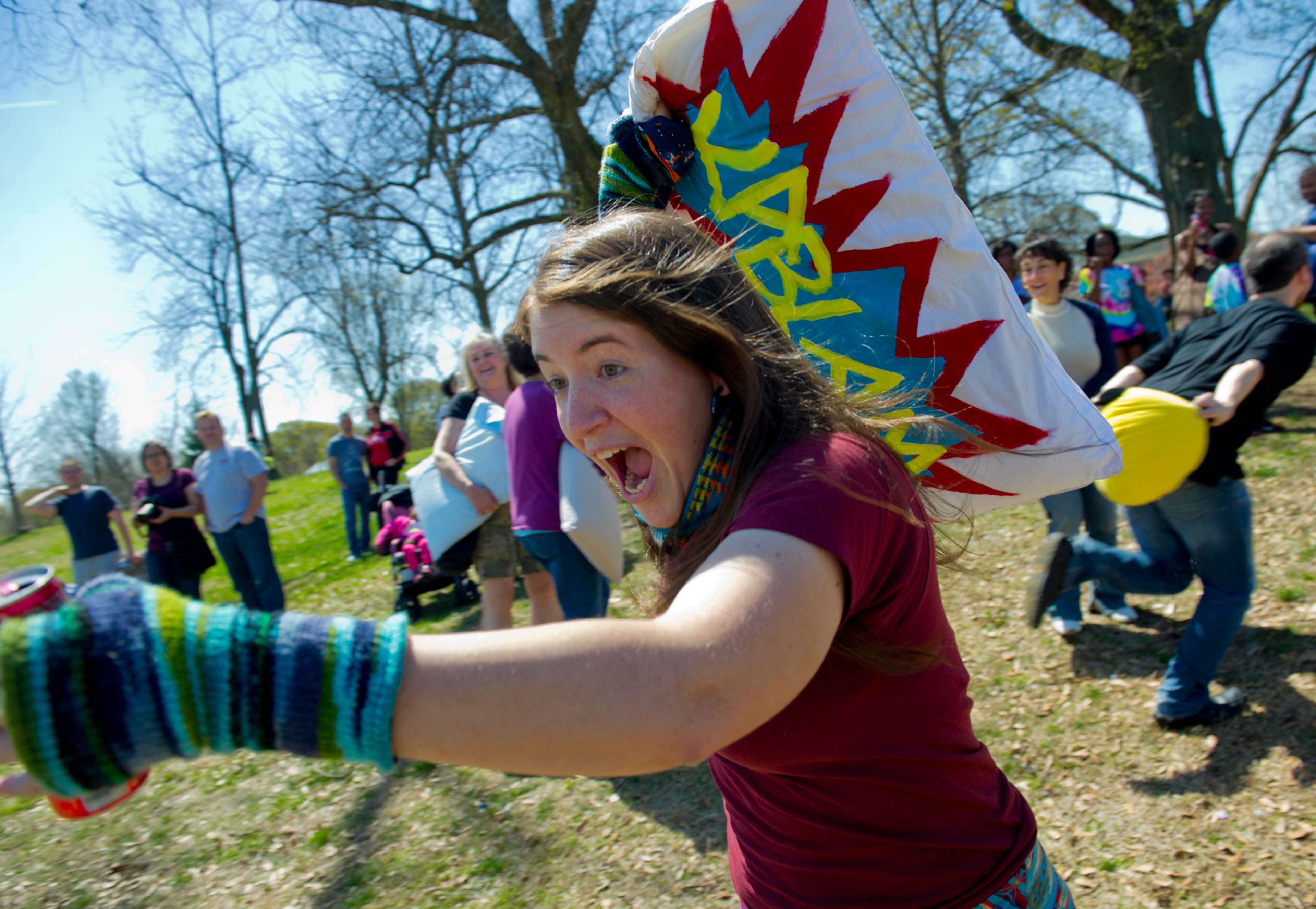 Elena Simon yells as she charges into the fray with her pillow.