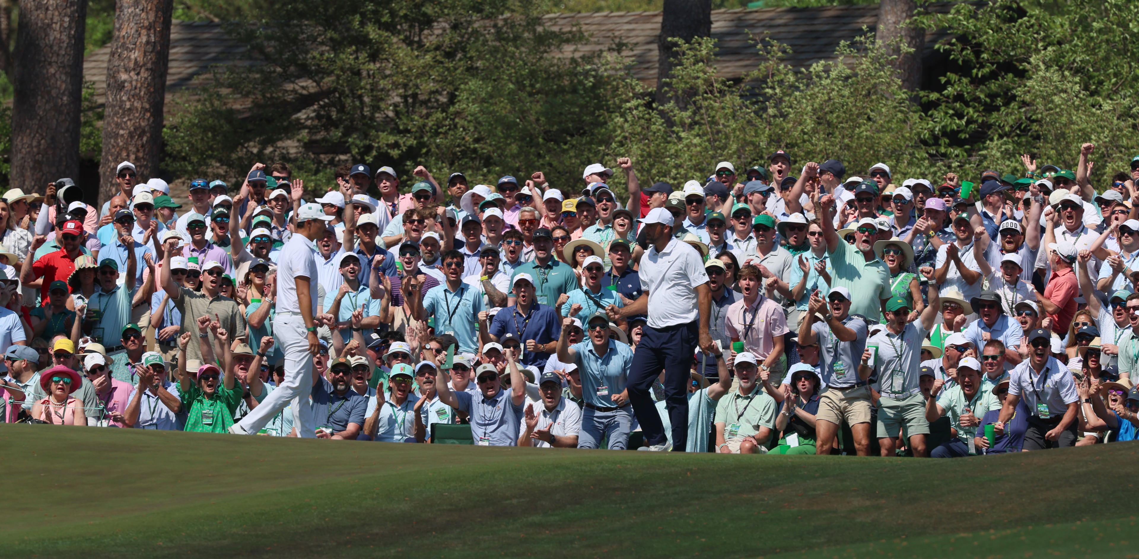Scottie Scheffler and patrons react after he made a putt on sixth green during final round of the Masters, at Augusta National Golf Club, Sunday, April 12, 2026, in Augusta, GA (Jason Getz/AJC)