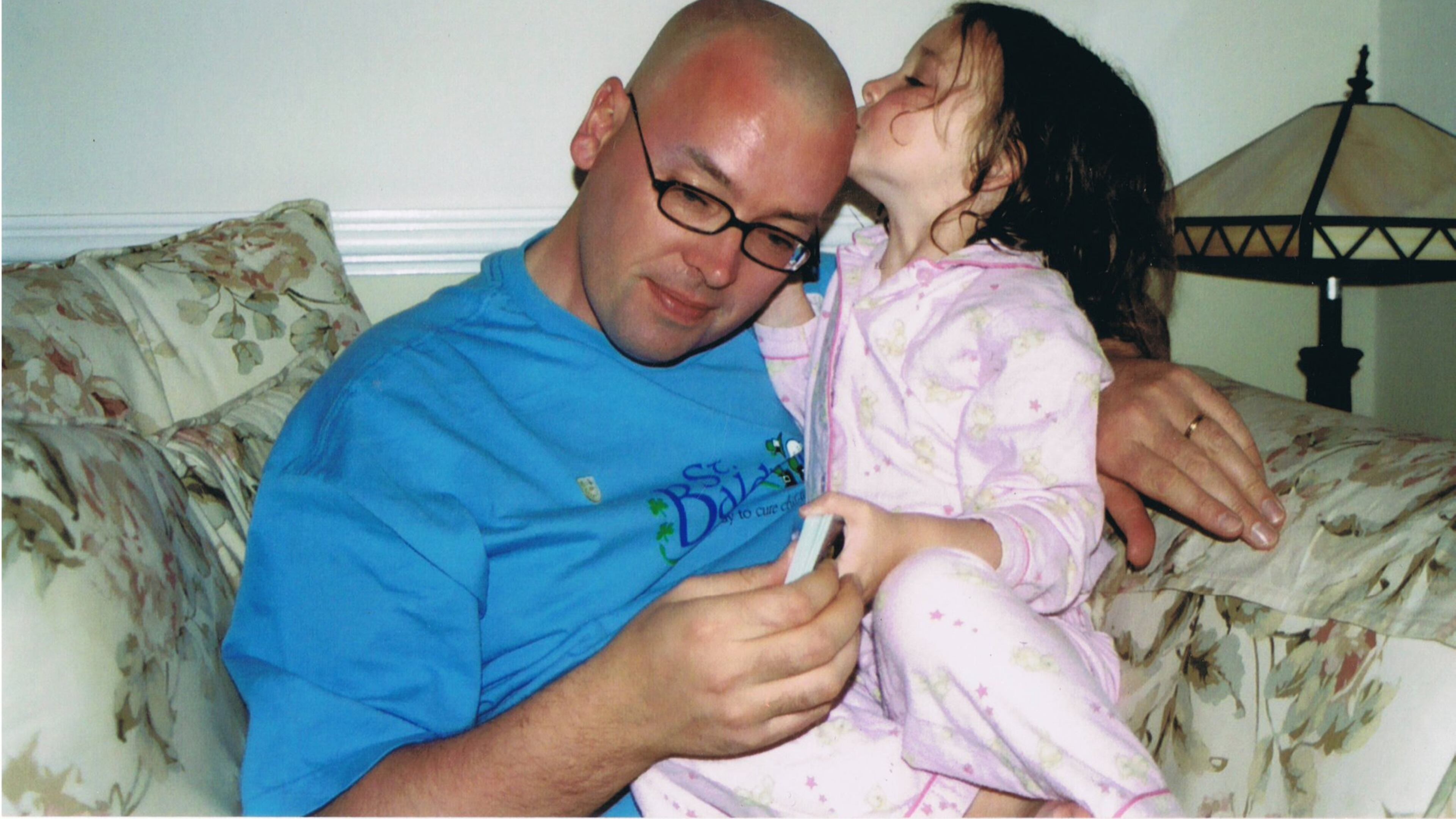 Ciara Fleming, who was diagnosed with a rare tissue cancer at age 23 months, kisses her father Donal’s shaved head. Ciara completed her treatment when she was a toddler and is 18 and cancer-free today. Donal Fleming has raised more than $1.3 million on behalf of the nonprofit St. Baldrick Foundation. Contributed
