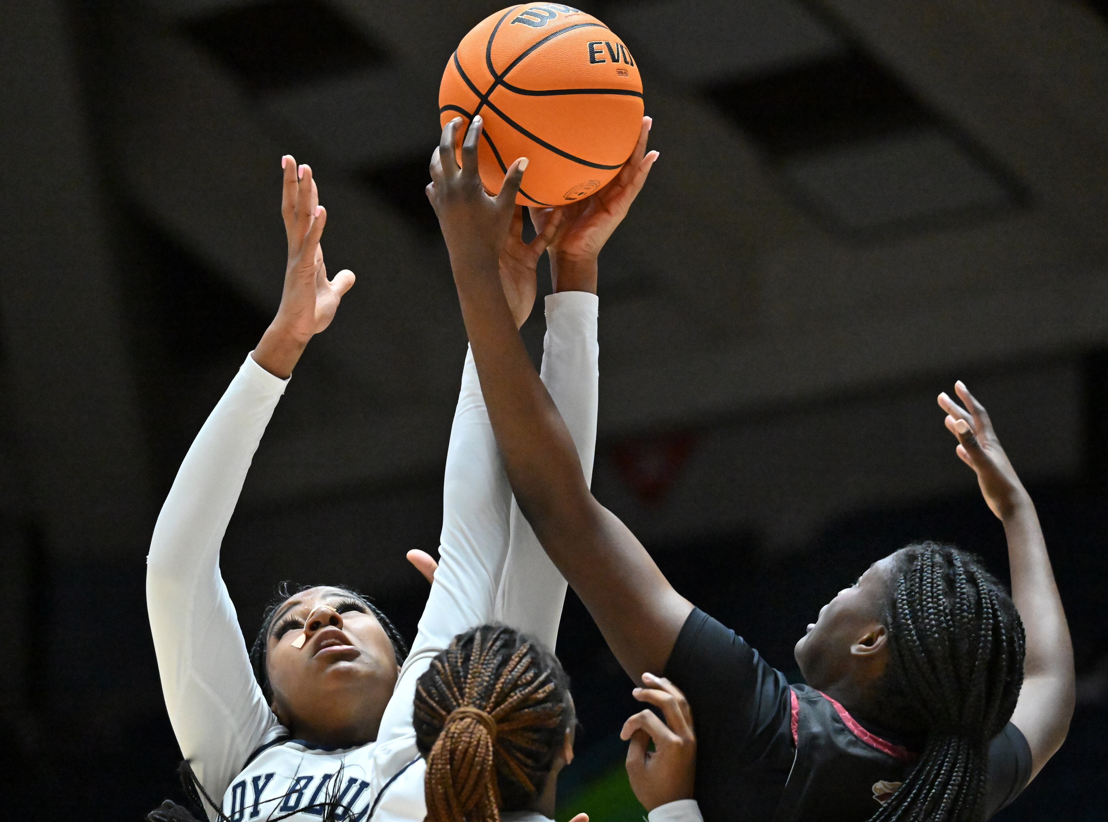 Norcross's Mariyah Valrie (left) and Brookwood's Danielle Osho (right) fight for a rebound. (Hyosub Shin / Hyosub.Shin@ajc.com)