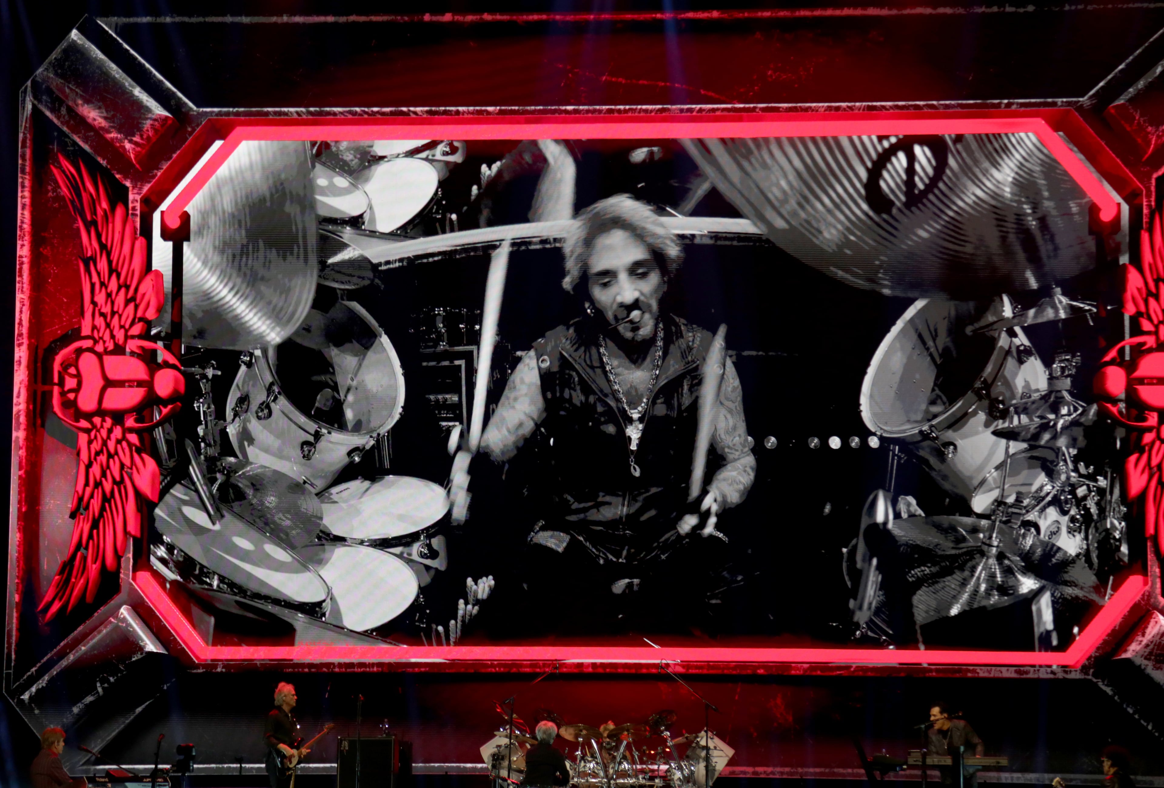 Journey drummer Joseph Castronovo is projected on the big screen during the band’s “Final Frontier Tour” at the State Farm Arena. (Akili-Casundria Ramsess for the AJC)