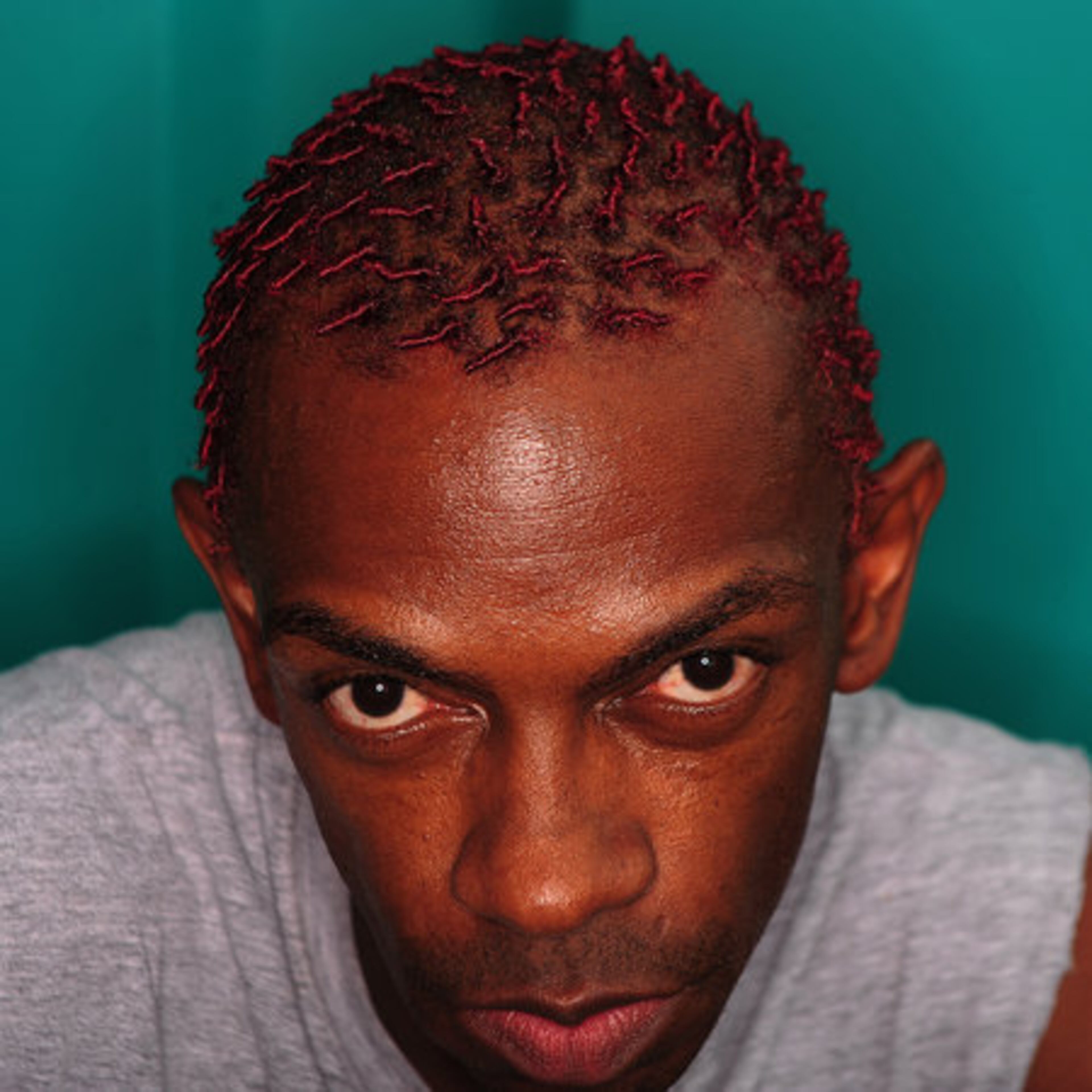 Sam William, a hair stylist sports his new hair-do. Williams picked the color red because it matched his 'hot' personality.
