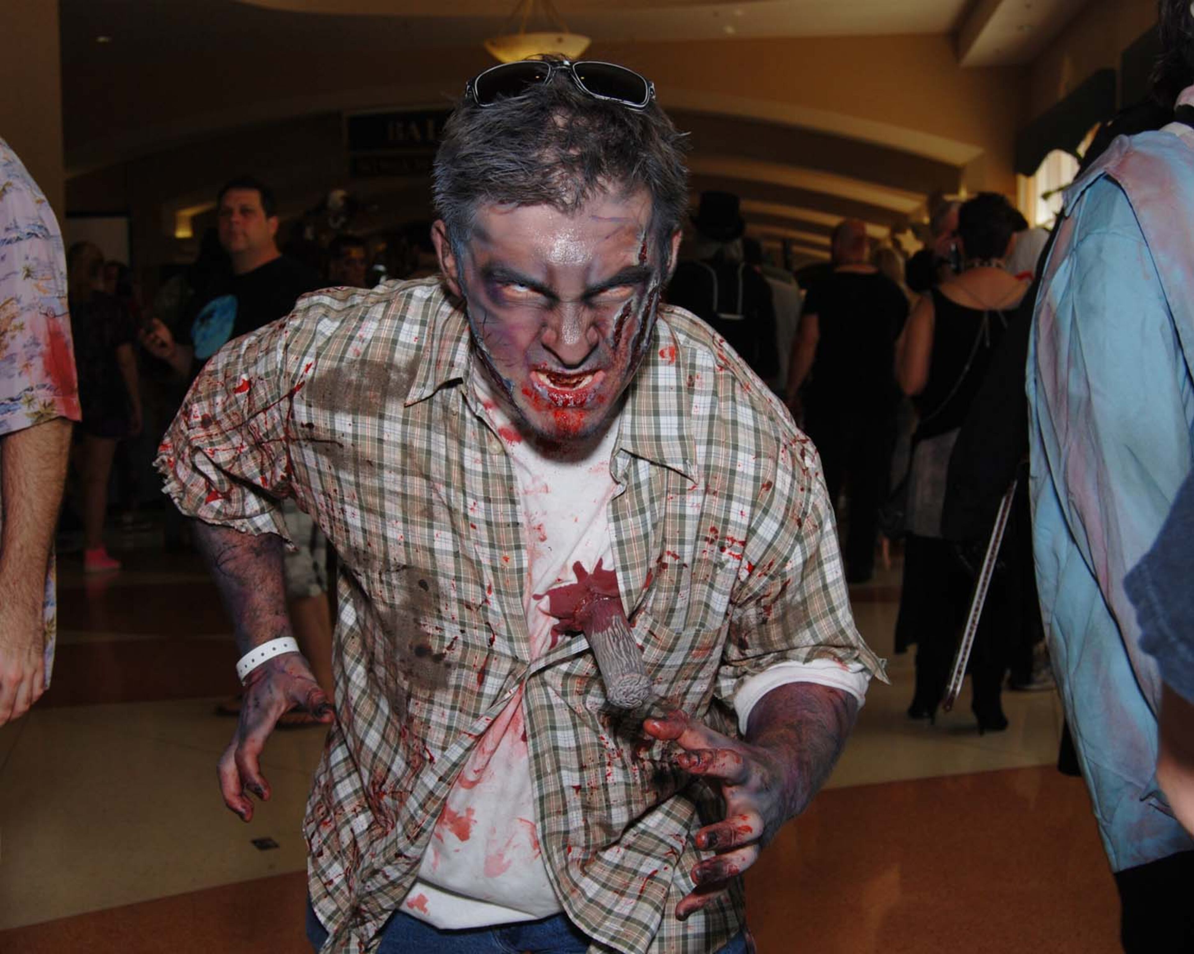 A pack of blood-thirsty zombies marched on the Rosen Centre Hotel in Orlando, Florida to kick off Spooky Empire's annual May-Hem horror convention.