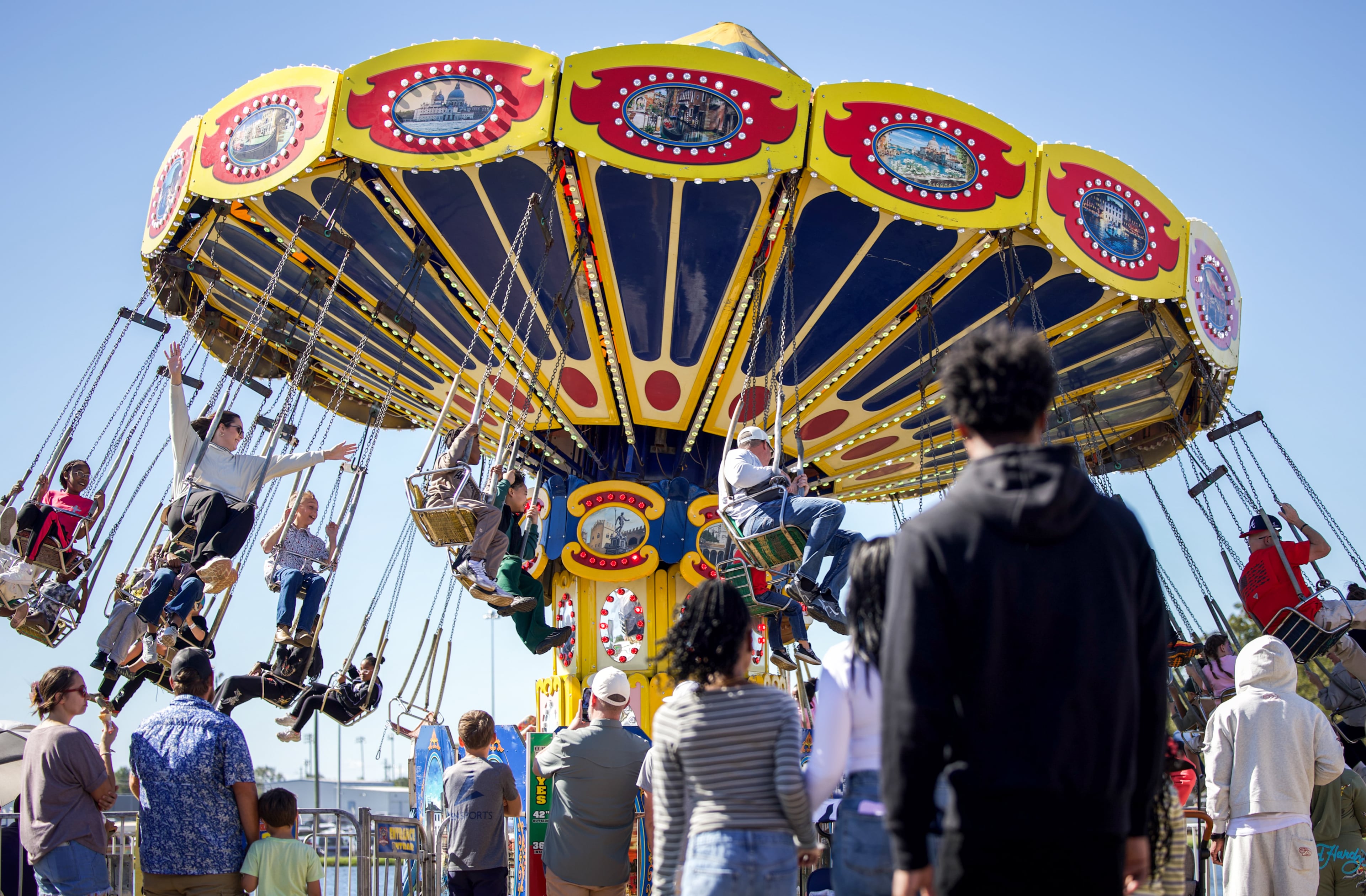 Fairgoers enjoy the swing ride at the Georgia National Fair in Perry, Georgia, on Oct. 17, 2026. The first Georgia National Fair was held in 1990. (Emily Laycock/UGA Photojournalism Workshop)