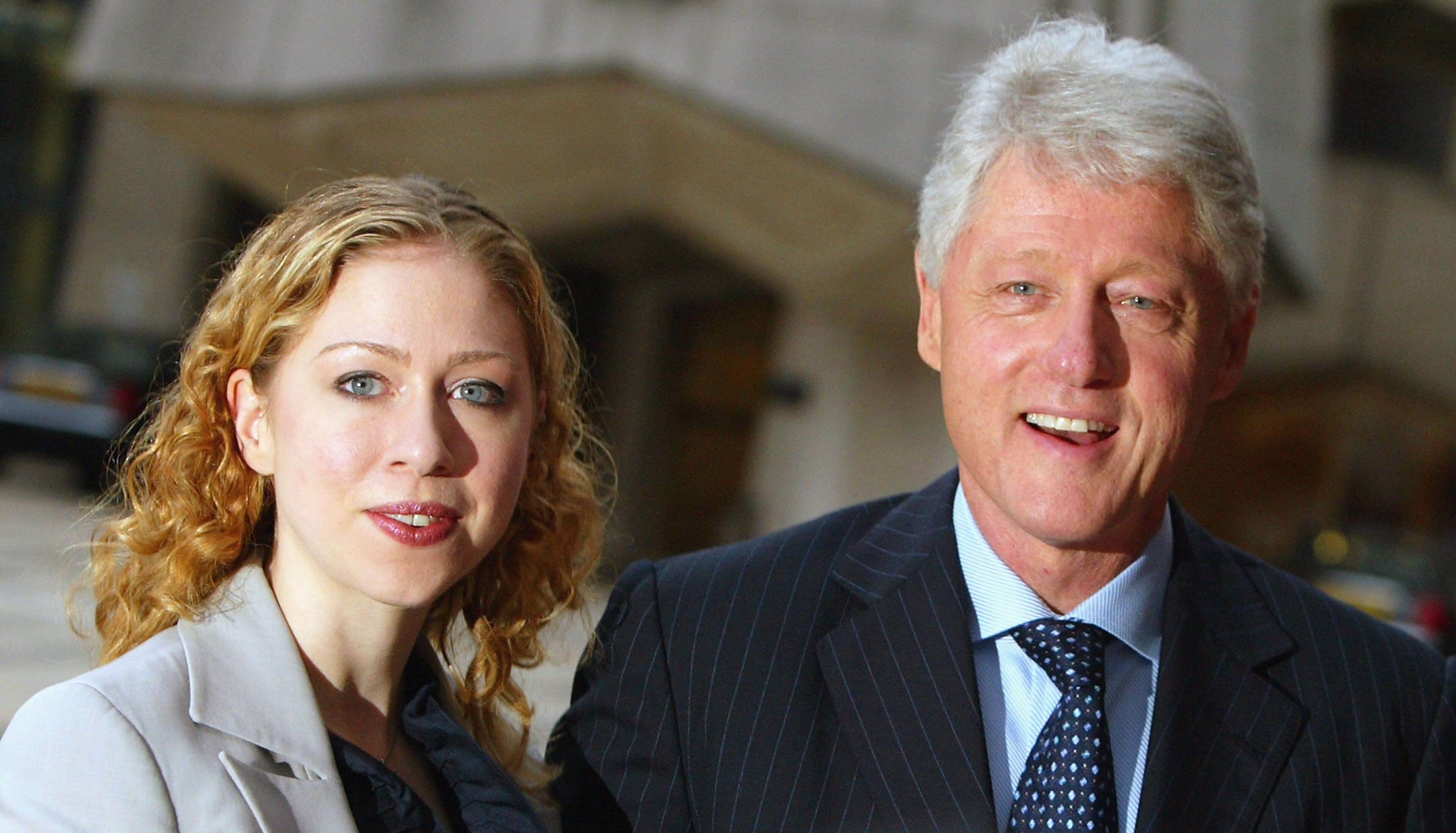Bill Clinton (R) and his daughter Chelsea Clinton arrive to attend the launch party for "My Life", the memoirs of the former US President Bill Clinton, on July 12, 2004 in London, England. (Photo by Scott Barbour/Getty Images)