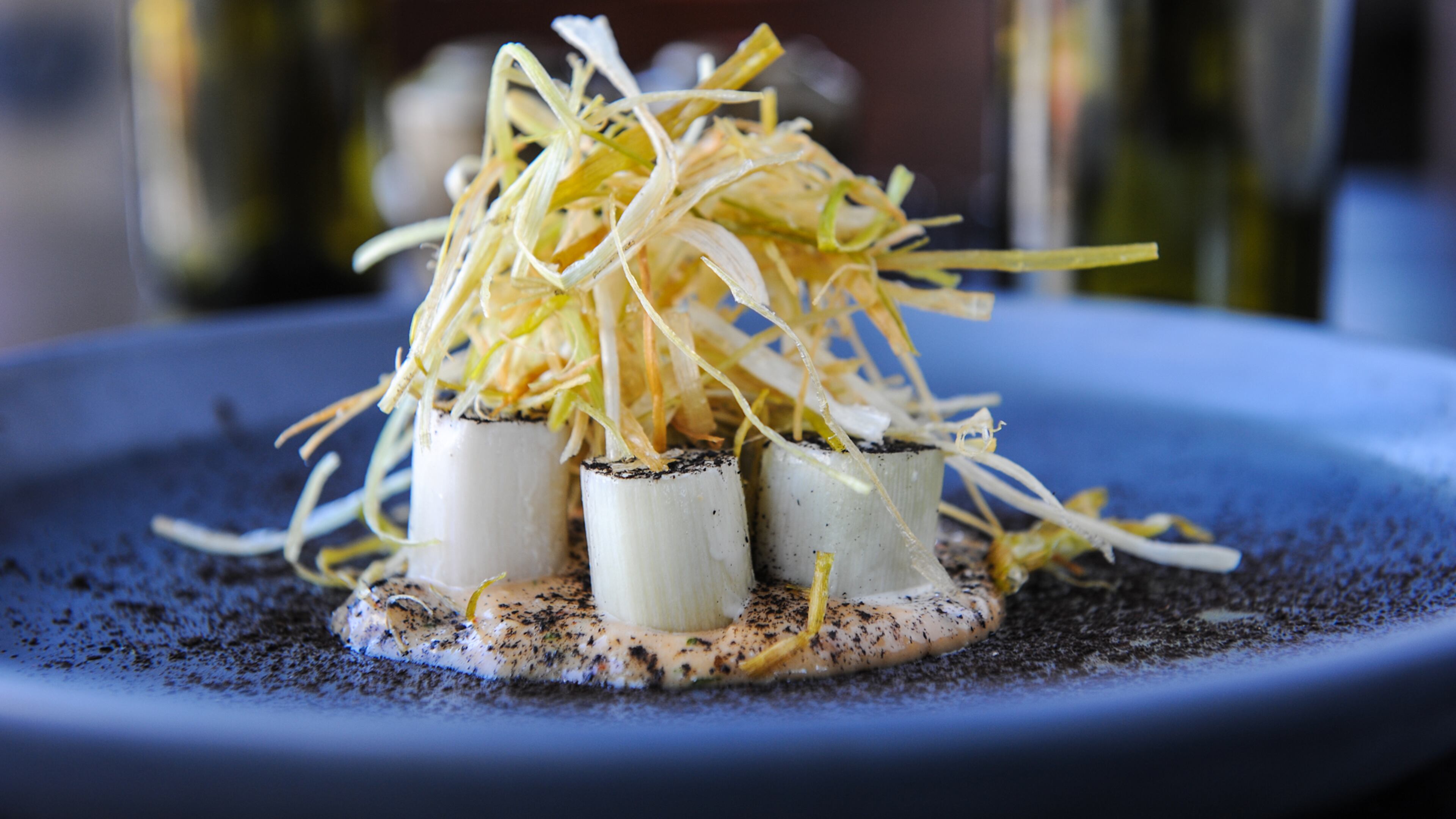 Gypsy Kitchen in Buckhead was named one of the 100 Top Hottest Restaurants in the U.S. by OpenTable. Pictured is its dish of chilled charred-steamed leeks with salbitxada sauce and leek ash. Photo by Becky Stein.