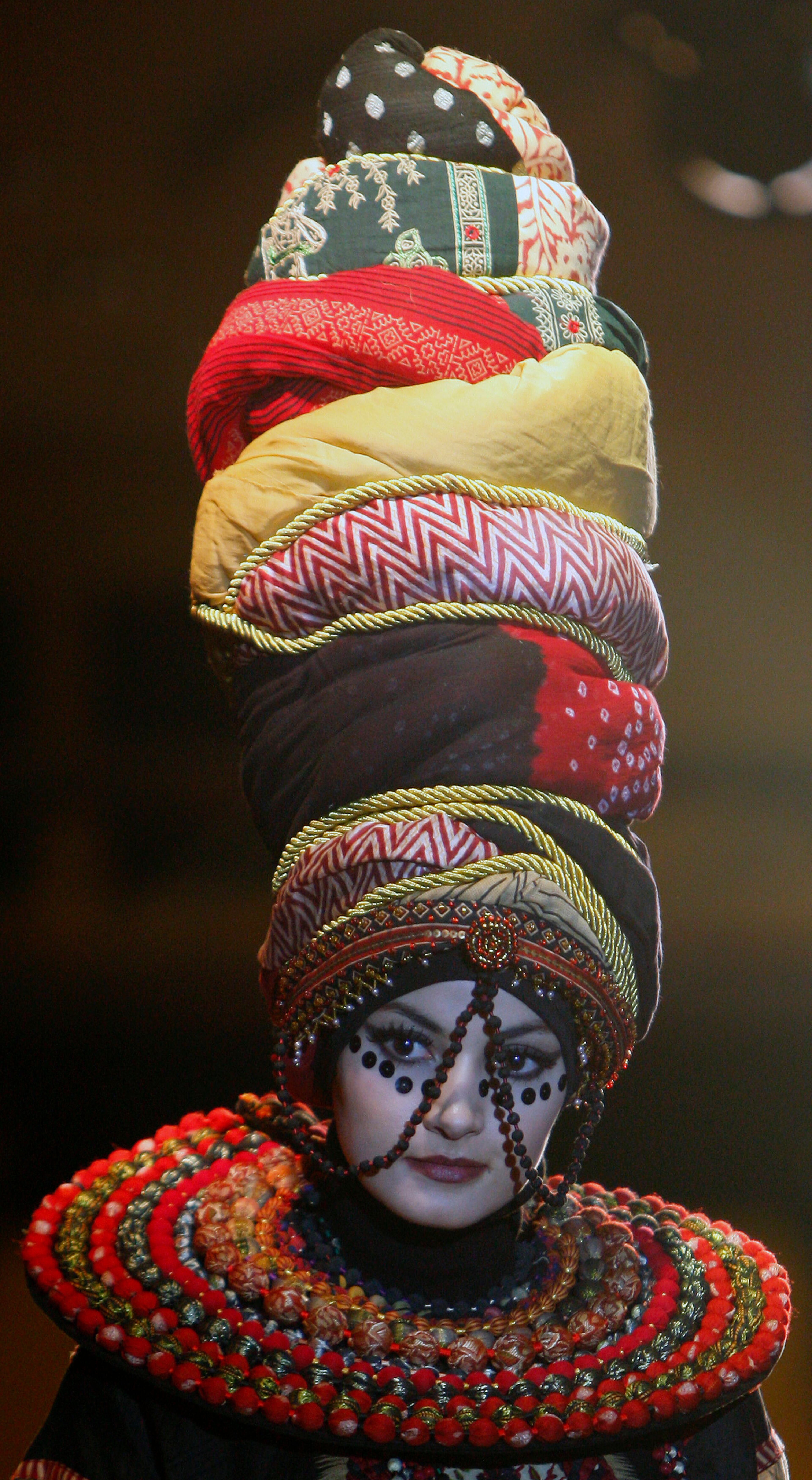 A model presents a creation by designer Paul Robb from Indonesia during the Islamic Fashion Festival in Kuala Lumpur, Malaysia, Monday, Nov. 5, 2012.