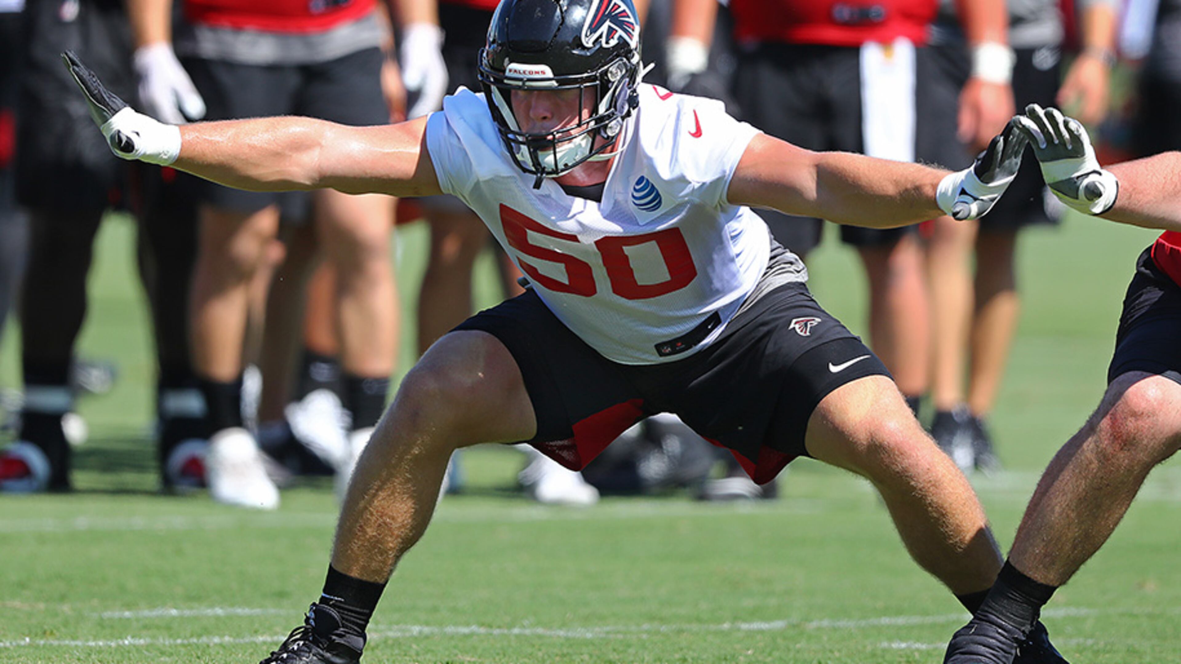 Falcons defensive end John Cominsky joins the offensive line on special teams to block for a kick during the third practice of training camp Wednesday, July 24, 2019, in Flowery Branch.