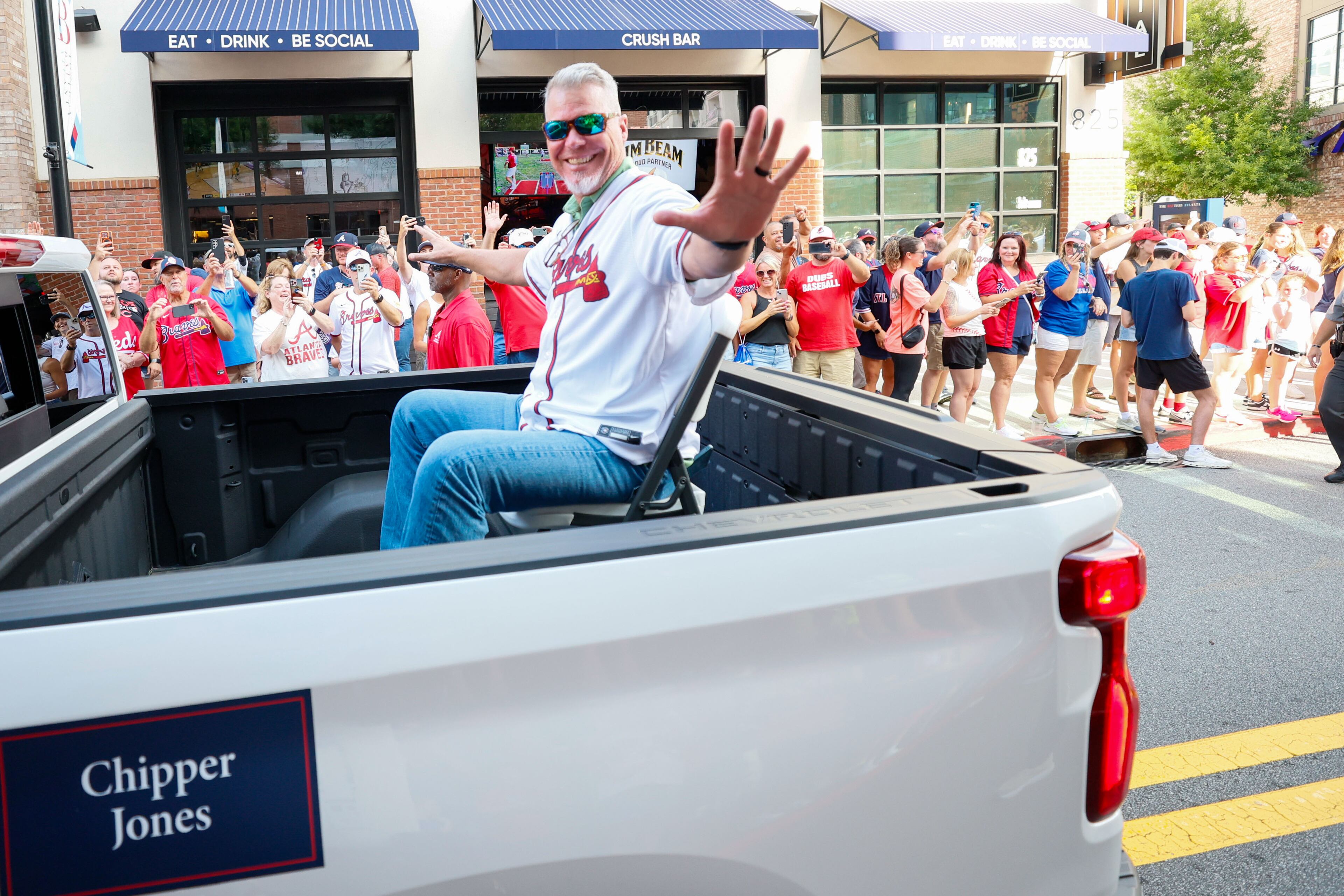 Braves legend and Baseball Hall of Famer Chipper Jones waves to the fans during the alumni parade through The Battery Atlanta Monday as part of the unveiling celebrations for the 2025 All-Star game logo at Truist Park.
(Miguel Martinez/ AJC)