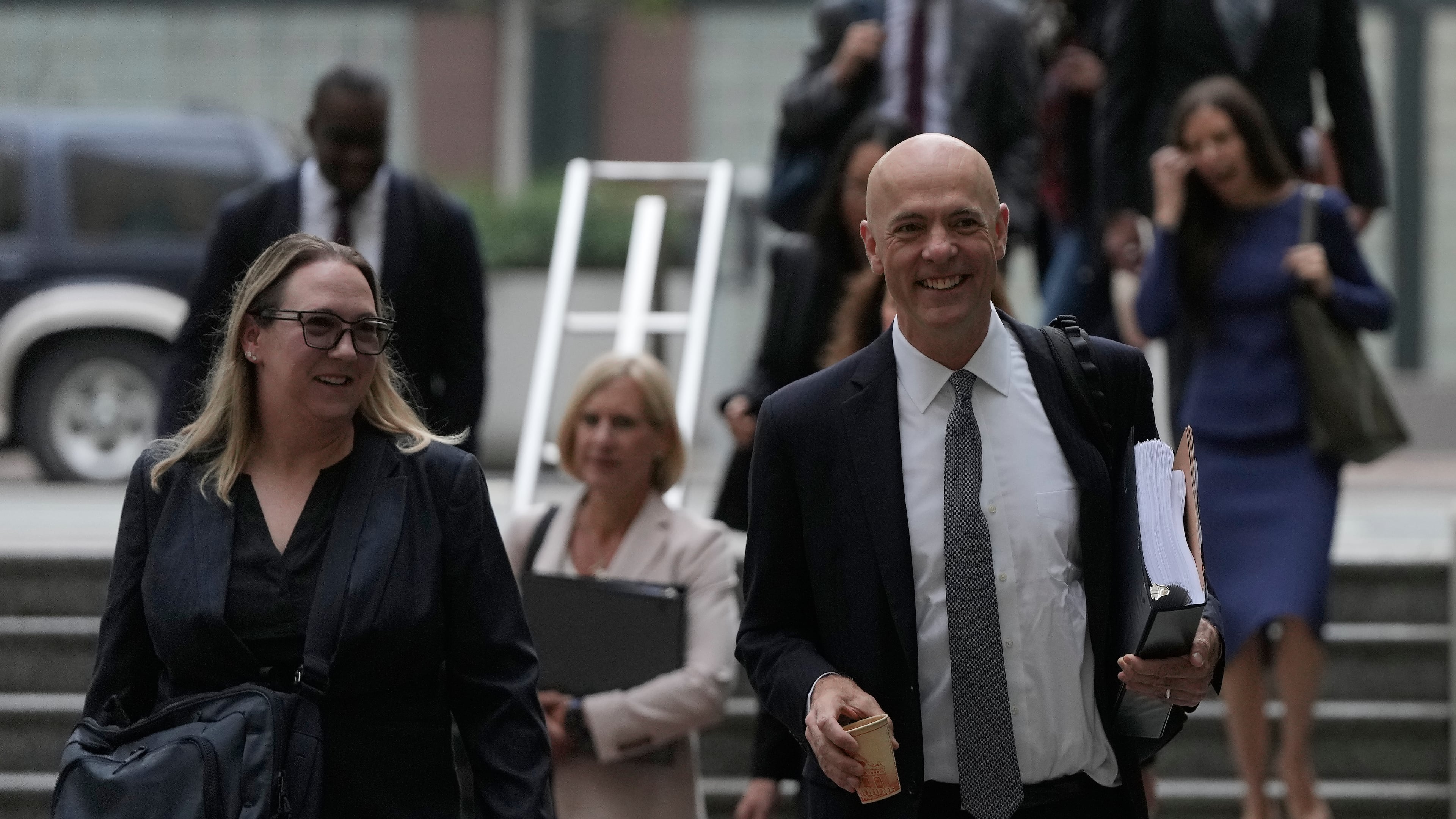 Attorney Paul W. Schmidt, representing Meta, right, arrives at a Federal Courthouse Wednesday, Aug. 12, 2026, in Oakland, Calif. (AP Photo/Jeff Chiu)