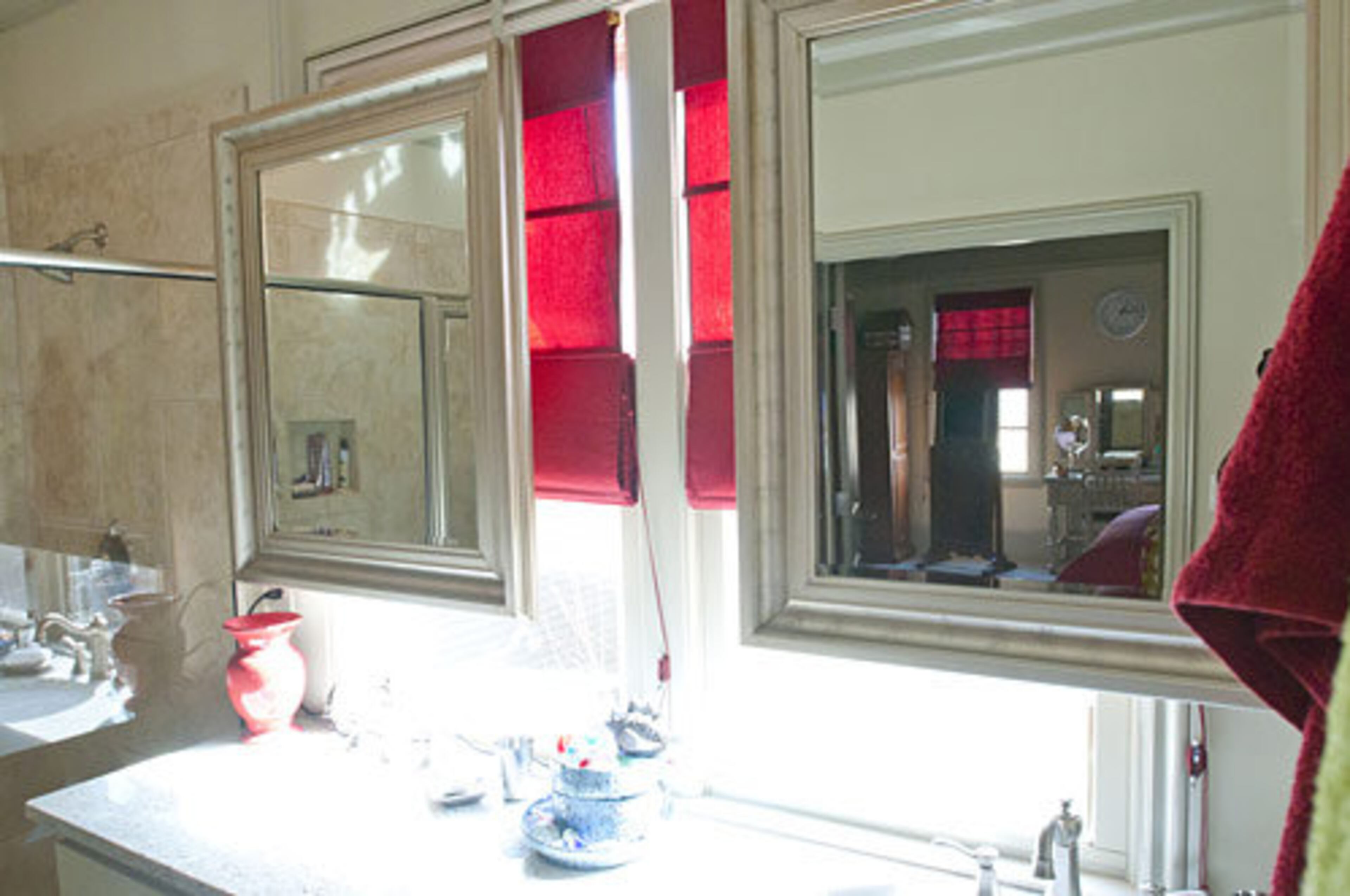 "The mirrors in the master bedroom came standard in the home. The way they are hung give the room a rustic feel to it."