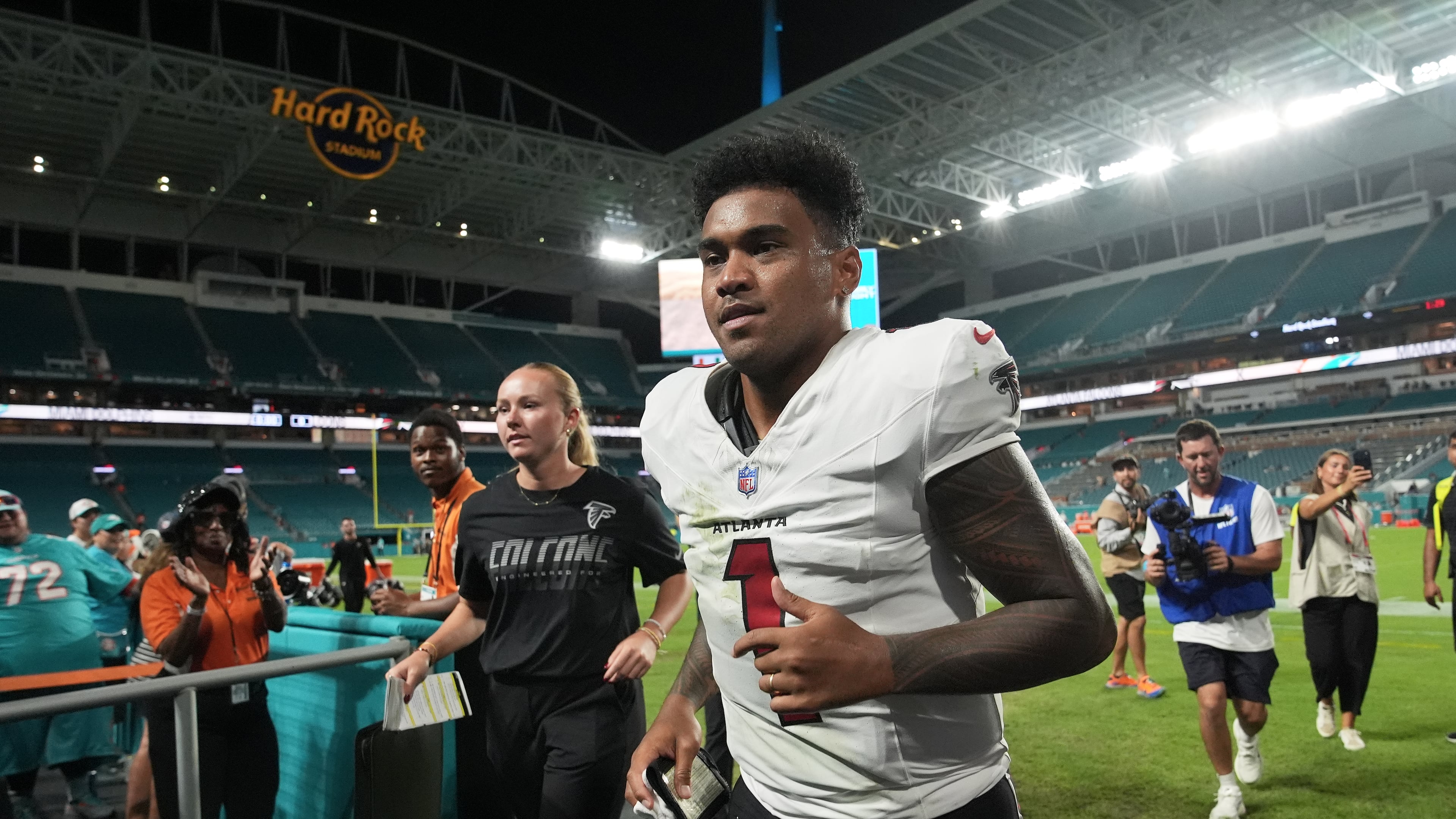Atlanta Falcons quarterback Tua Tagovailoa (1) jogs off the field after an NFL preseason football game against the Miami Dolphins, Friday, Aug. 28, 2026, in Miami Gardens, Fla. (AP Photo/Lynne Sladky)