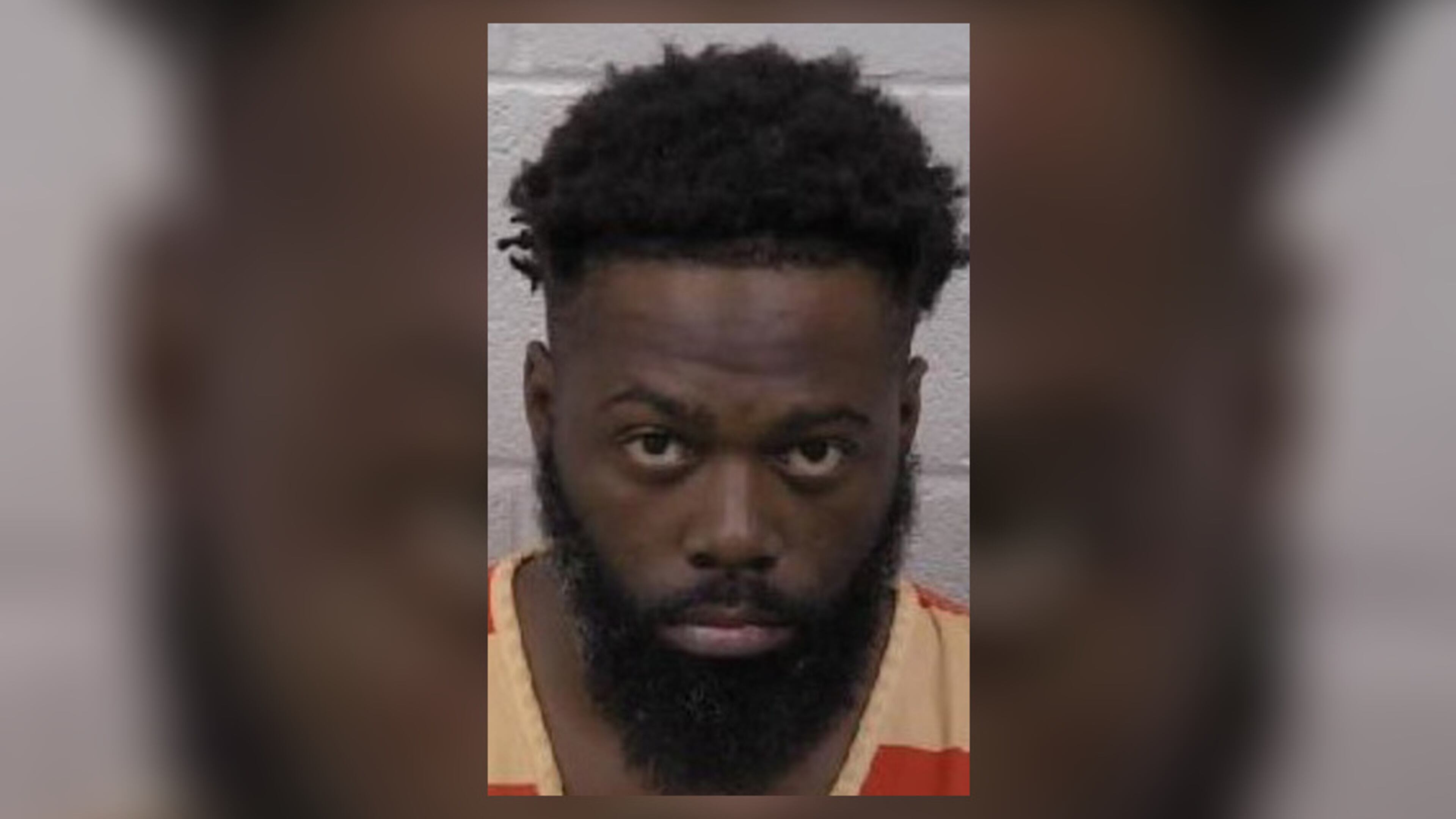 Charlie Wilson Moore, 35, was being held without bond late Monday.