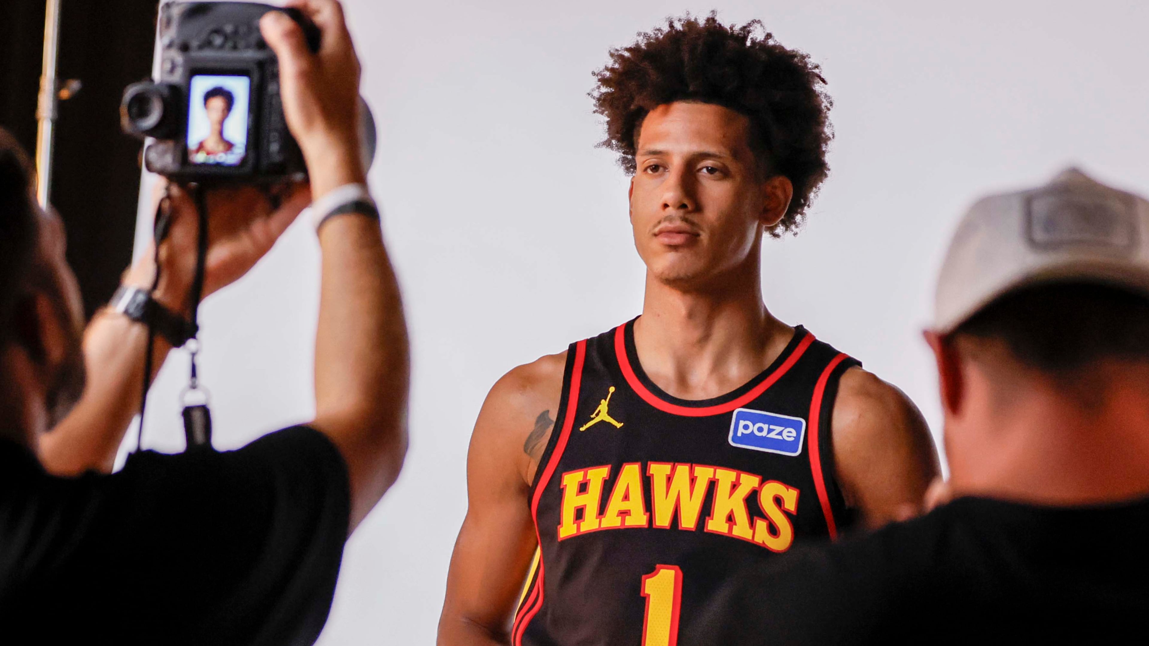Atlanta Hawks forward Jalen Johnson has his photo taken by the NBA's Adam Hagy during media day 2025. (Miguel Martinez/AJC)