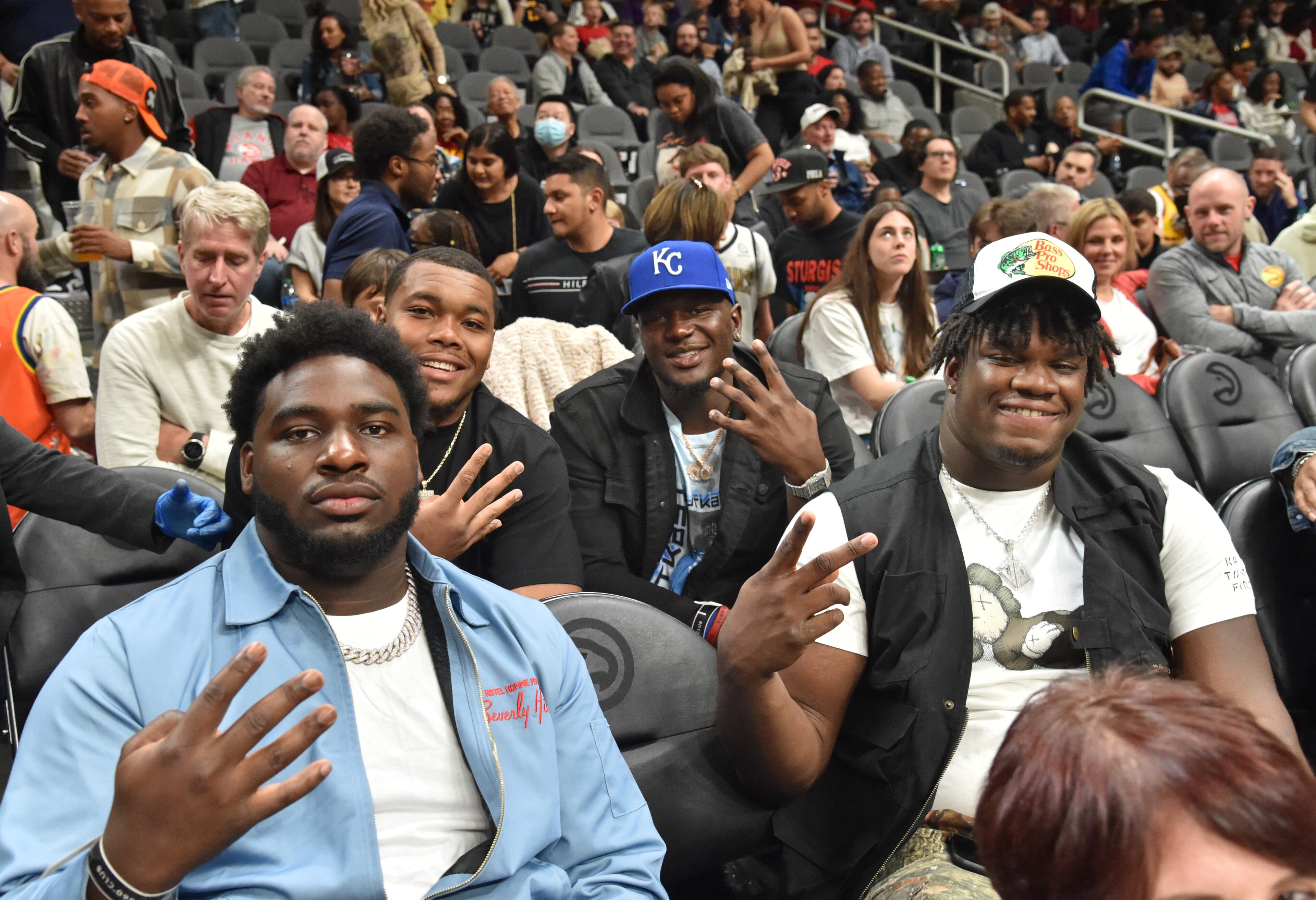 Georgia Bulldogs including Jordan Davis (right) attend during an NBA basketball game at State Farm Arena on Thursday, March 31, 2022. Atlanta Hawks won 131-107 over Cleveland Cavaliers. (Hyosub Shin / Hyosub.Shin@ajc.com)