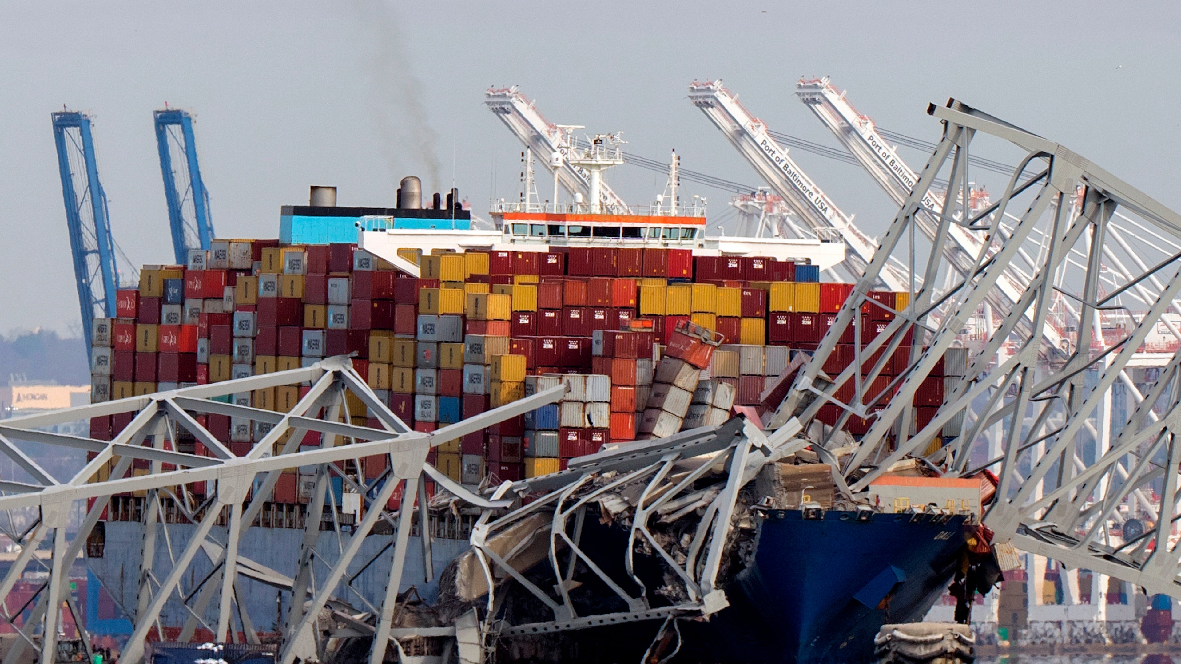 FILE - The cargo ship Dali is stuck under part of the Francis Scott Key Bridge after the ship hit the bridge, March 26, 2024, as seen from Pasadena, Md. (AP Photo/Mark Schiefelbein, File)