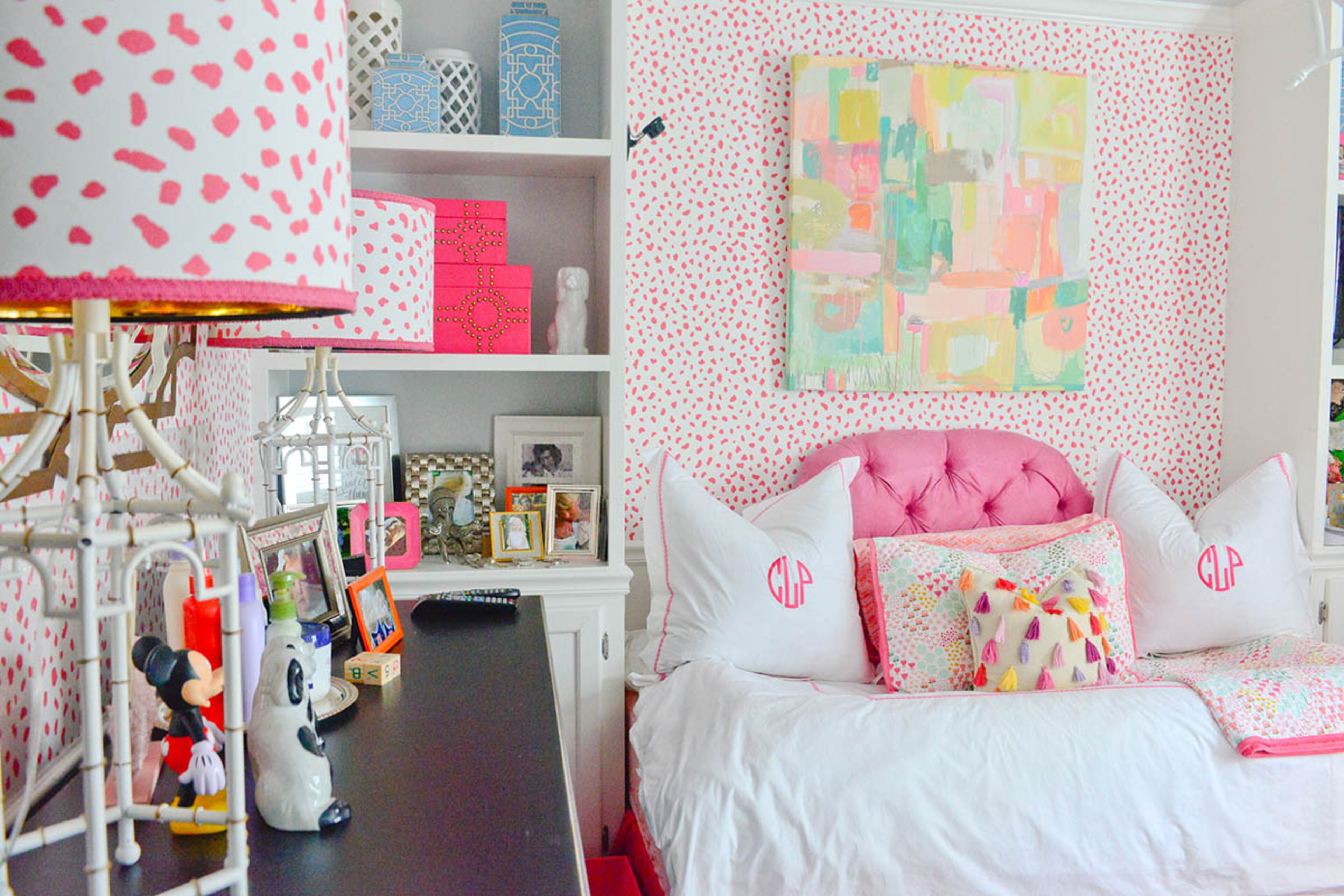 Two-year-old Caroline's bedroom is a splash of pink. The canvas above her bed, from One Kings Lane and painted by Michelle Armas, is one of the first things Katie Luepke bought when she and her husband discovered they were having a girl. She loves that the piece is whimsical and fun without being obviously childish.