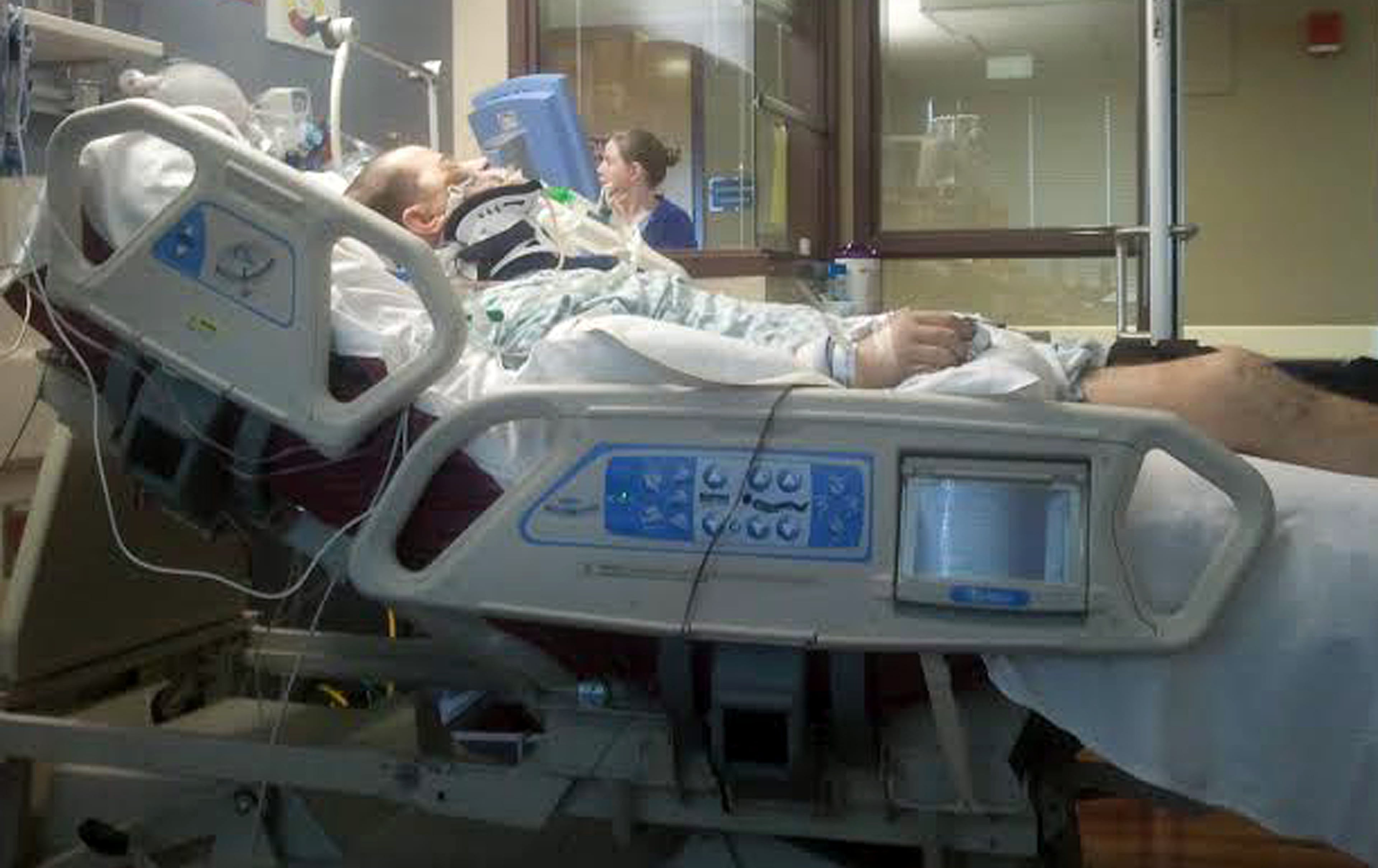 Jason lays in a hospital bed at Atlanta Medical Center in January 2013 days after his fall. He fell four stories from their apartment balcony and sustained serious injuries including a shattered heel and an epidural hematoma. After coming home, Jason then got a staph infection. Now, Jason is fighting to keep the foot that broke his fall and likely saved his life. FAMILY PHOTO