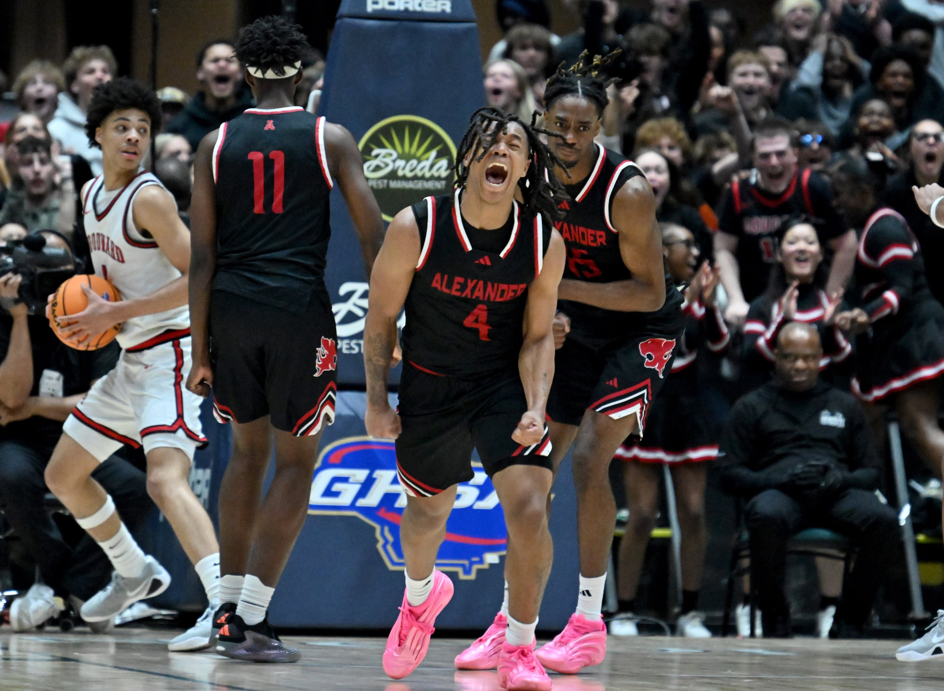 Alexander Gregory Dunson (4) reacts after Alexander Christian Moore (15) dunked the ball against Woodward Academy at the end of fourth quarter during Class 5A Boys GHSA State Championship at the Macon Coliseum, Friday, March 13, 2026, in Macon. Alexander won 81-67 over Woodward Academy. (Hyosub Shin/AJC)