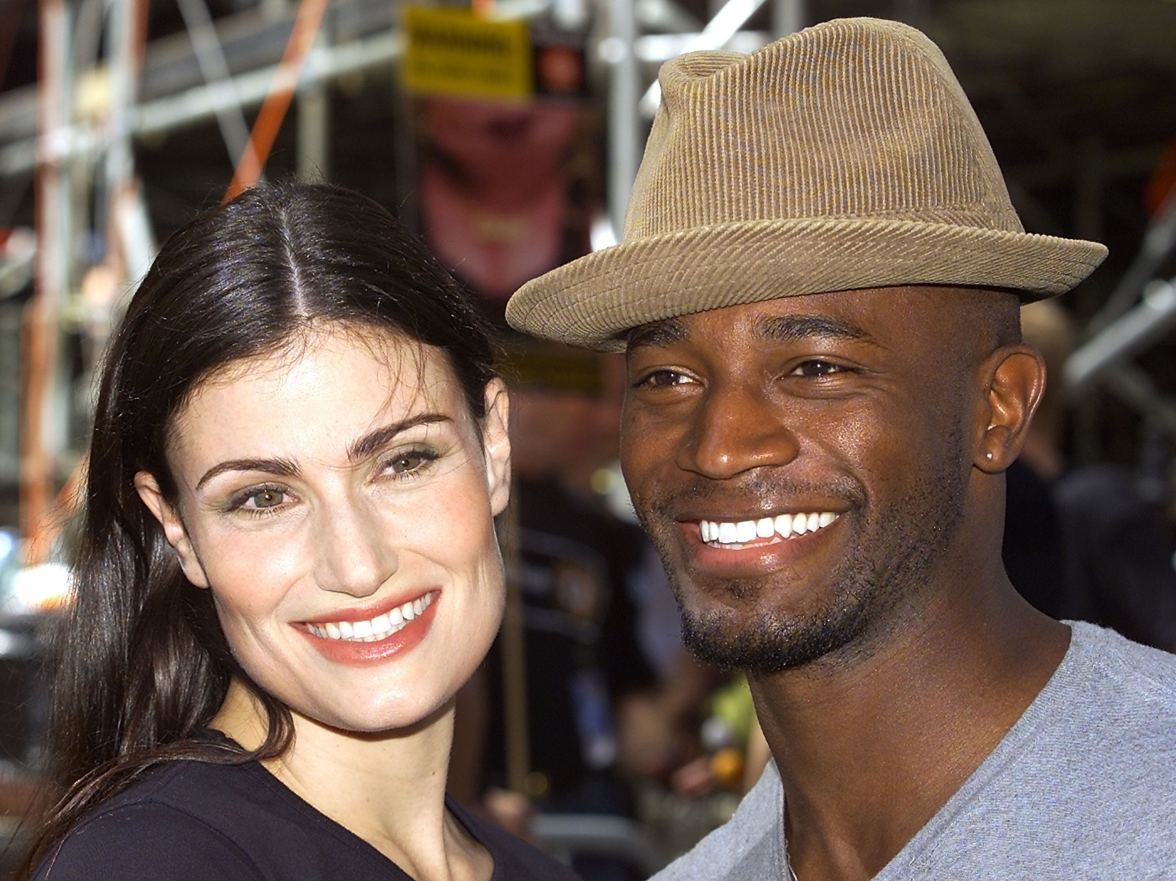 NEW YORK - SEPTEMBER 7: Actor Taye Diggs (R) and Idina Menzel(L) attend the 12th annual Broadway on Broadway free concert in Times Square September 7, 2003 in New York City. (Photo by Adam Rountree/Getty Images)