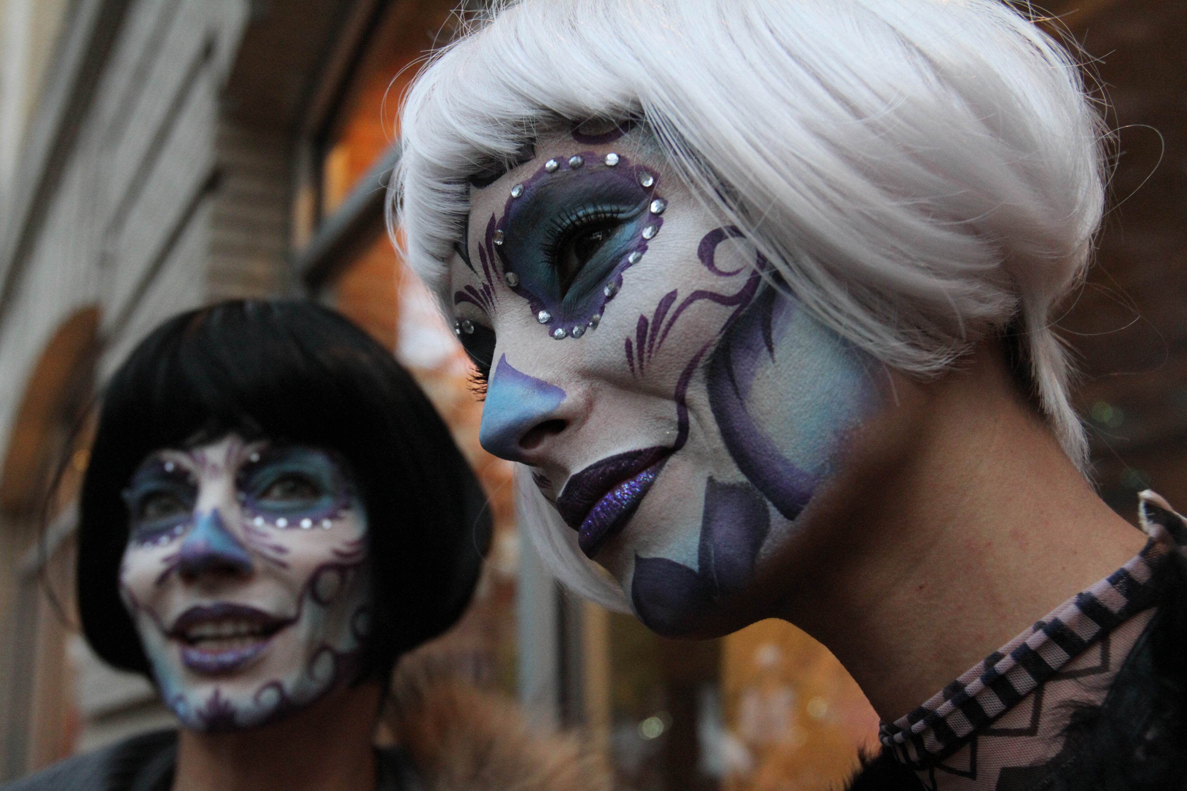 Angele Blank, right, and Virginia Promeyrat wait for the start of the Greenwich Village Halloween Parade, Saturday, Oct. 31, 2015 in New York. (AP Photo/Tina Fineberg)