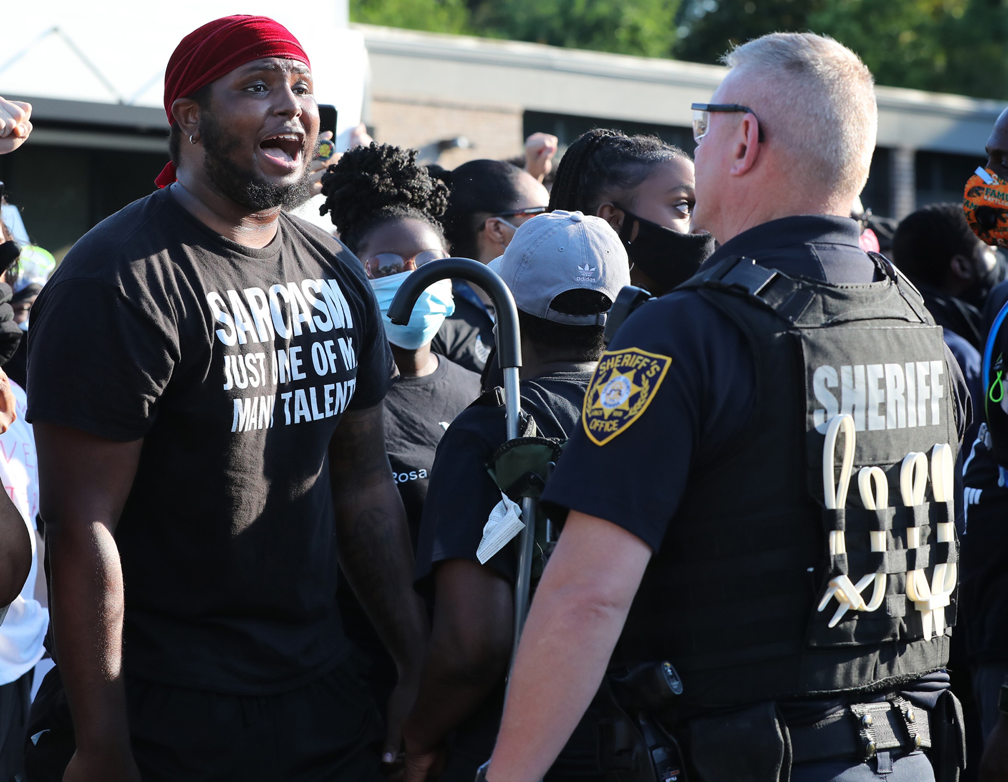 060120 Lawrenceville: A protester and a law enforcement official face off in Lawrenceville as protests continue for a fourth day around metro Atlanta over the death of George Floyd on Monday, June 1, 2020, in Lawrenceville. Curtis Compton ccompton@ajc.com