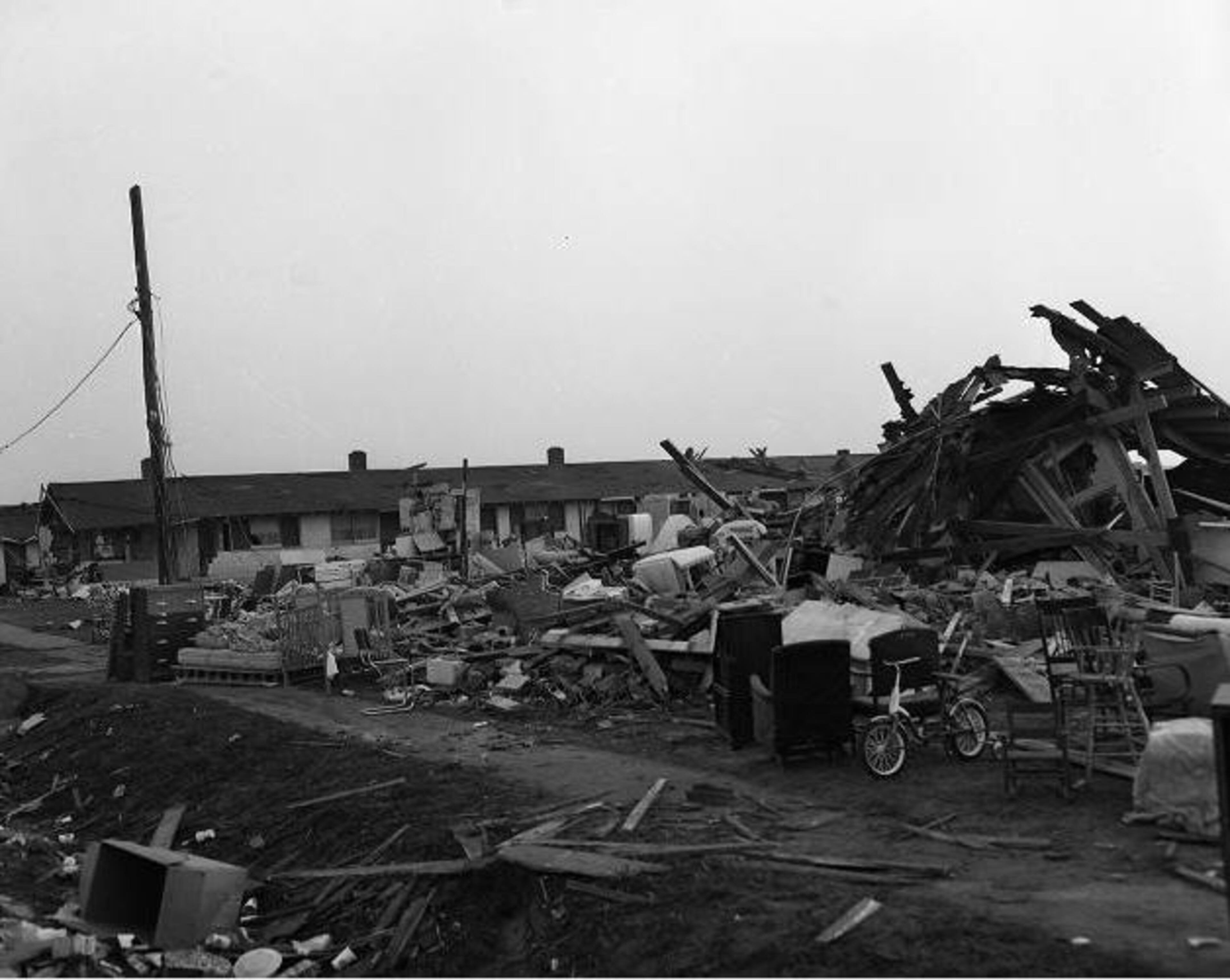 April 1953 -- A small bicycle stands out against tornado debris in Warner Robins. CREDIT: AJC Archives