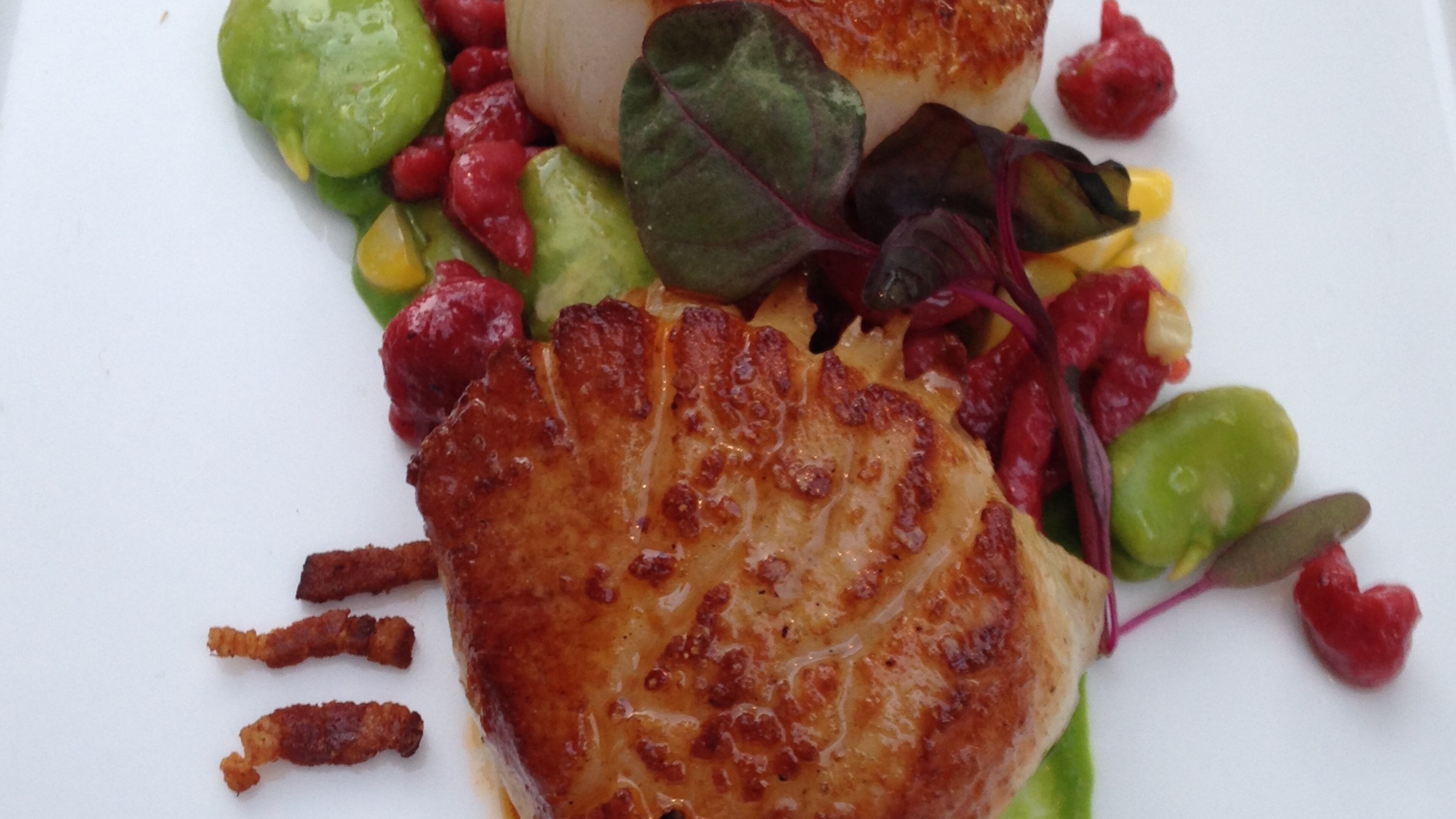 Pan-seared scallops with fava beans and bacon