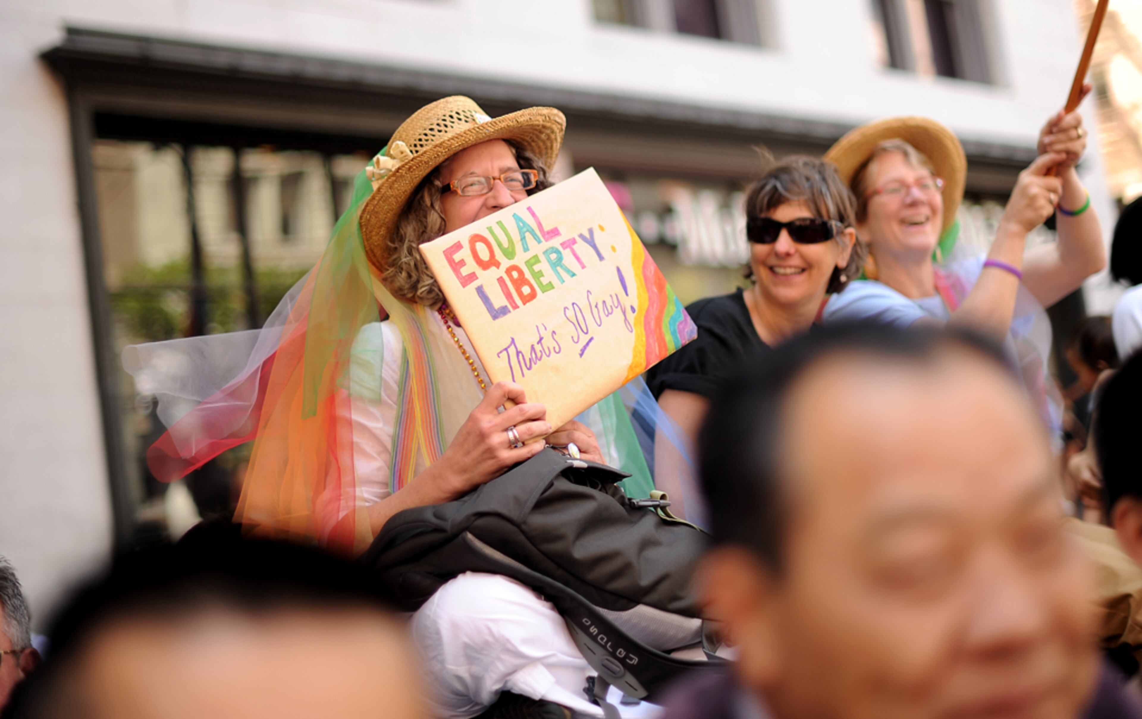 Elizabeth Jay holds a sign championing same-sex marriage during San Francisco's 43rd annual gay pride parade Sunday, June 30, 2013. (AP Photo/Noah Berger)