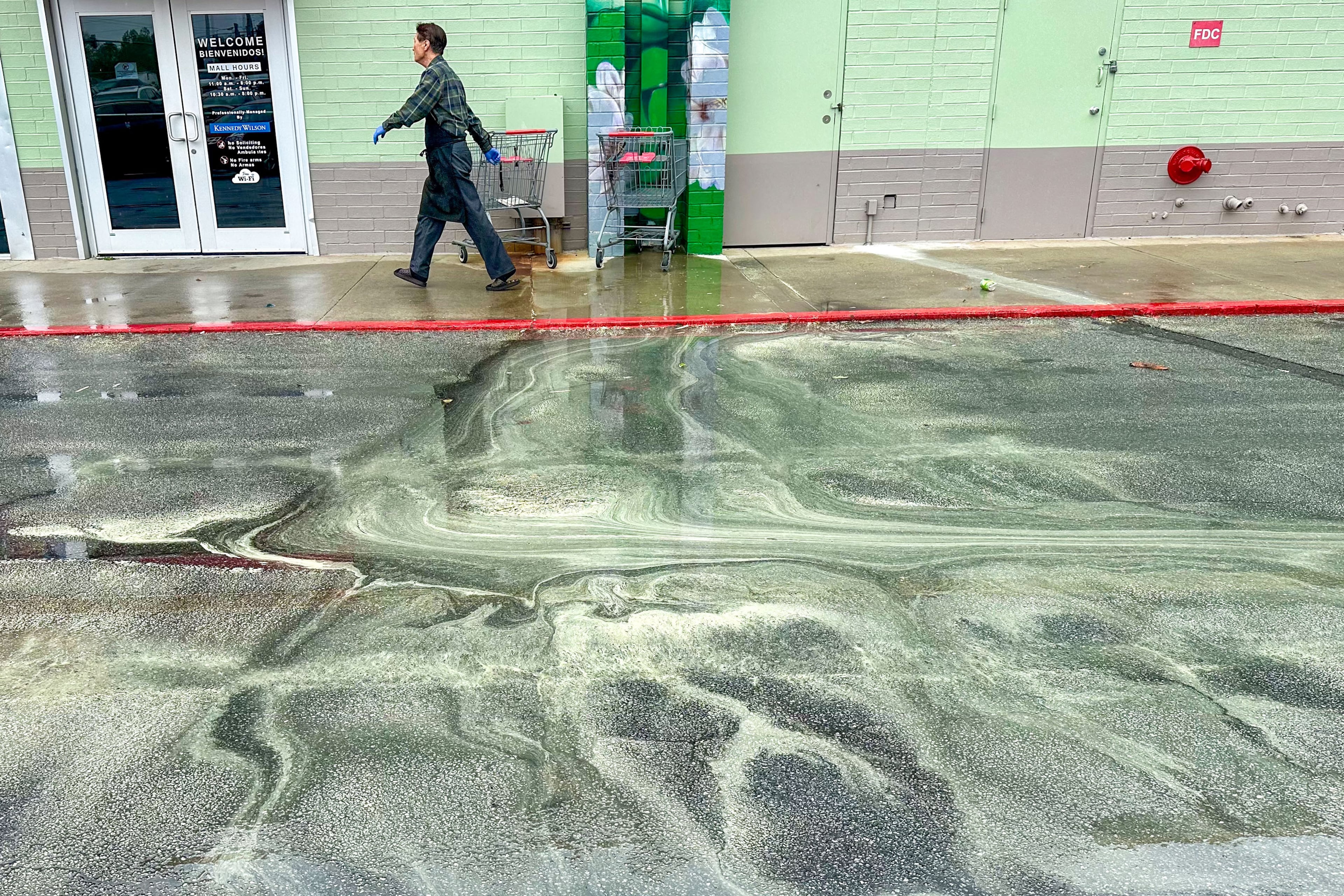 A person walks outside Plaza Fiesta on Buford Highway on Friday, March 22, 2024. The rain has begun, and it's starting to wash away the pollen, likely causing allergies or discomfort. The rain is anticipated to continue until early Saturday morning,
Miguel Martinez /miguel.martinezjimenez@ajc.com