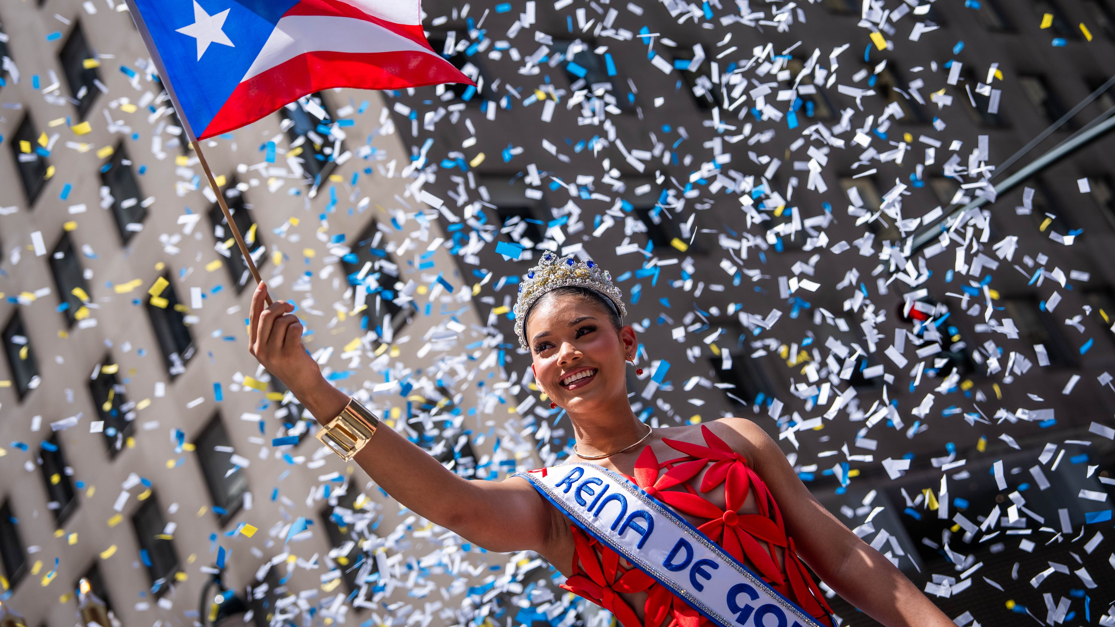 A person participates in the National Puerto Rican Day Parade, Sunday, June 14, 2026 in New York. (AP Photo/Adam Gray)