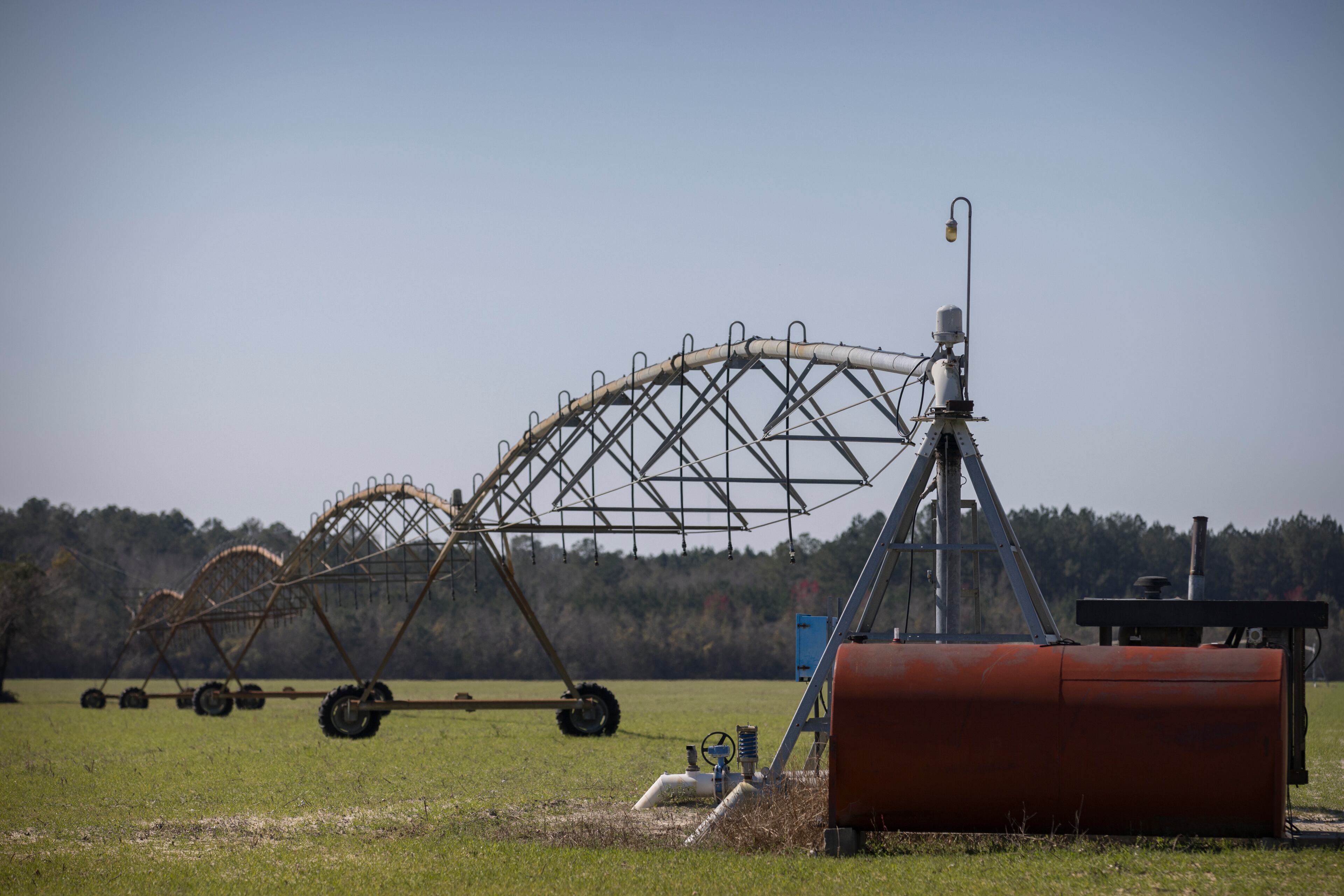 One of Ray Davis' wells and pivots that irrigate part of his 1,100 acres stands idle for the winter on Wednesday, Feb. 21, 2024 near Brooklet, Ga. Davis worries how groundwater pumping to supply the Hyundai EV plant will affect his wells. (AJC Photo/Stephen B. Morton)