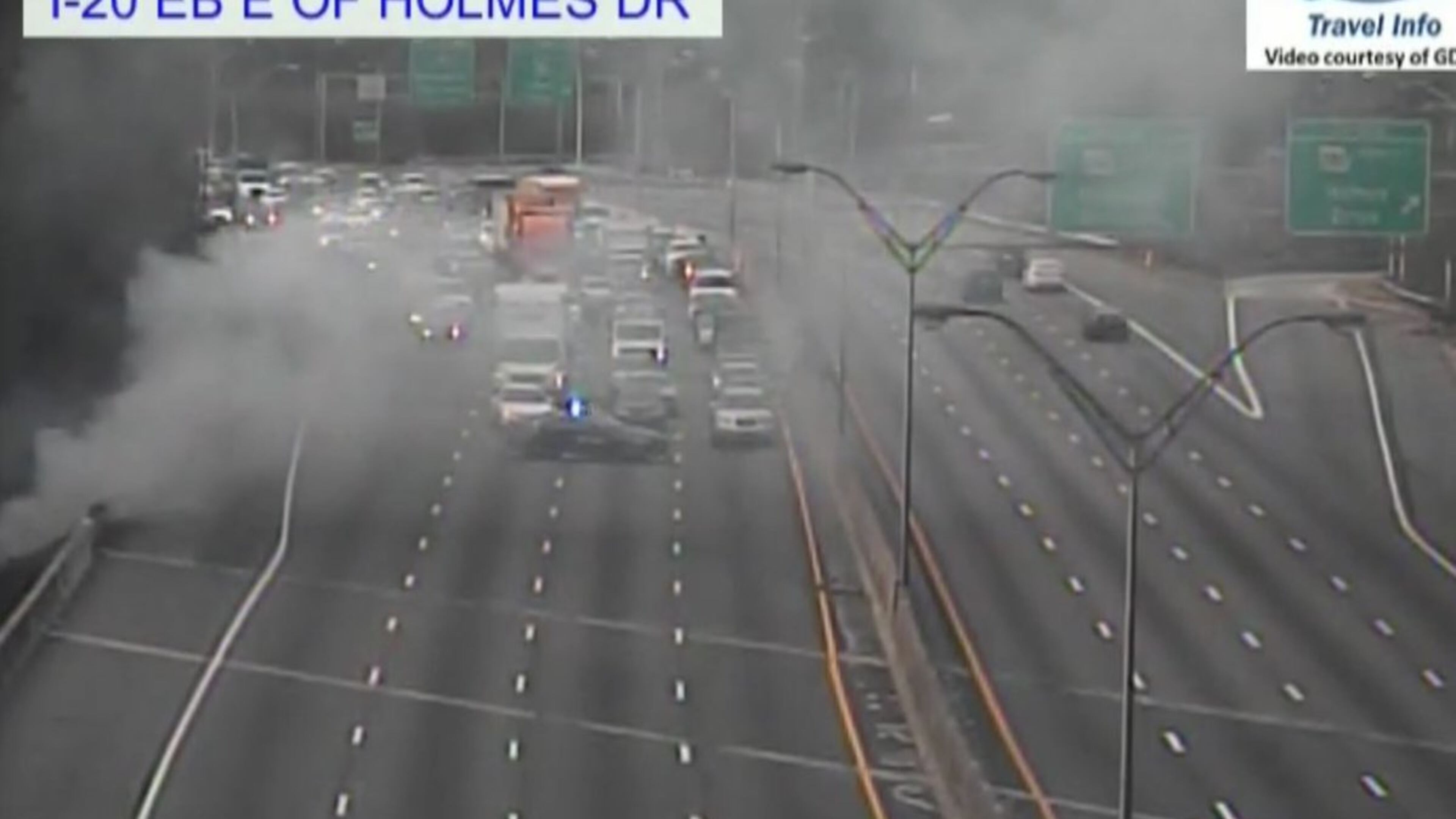 A brush fire and a multicar crash closed all lanes of I-20 near H.E. Holmes in Atlanta on Thursday.