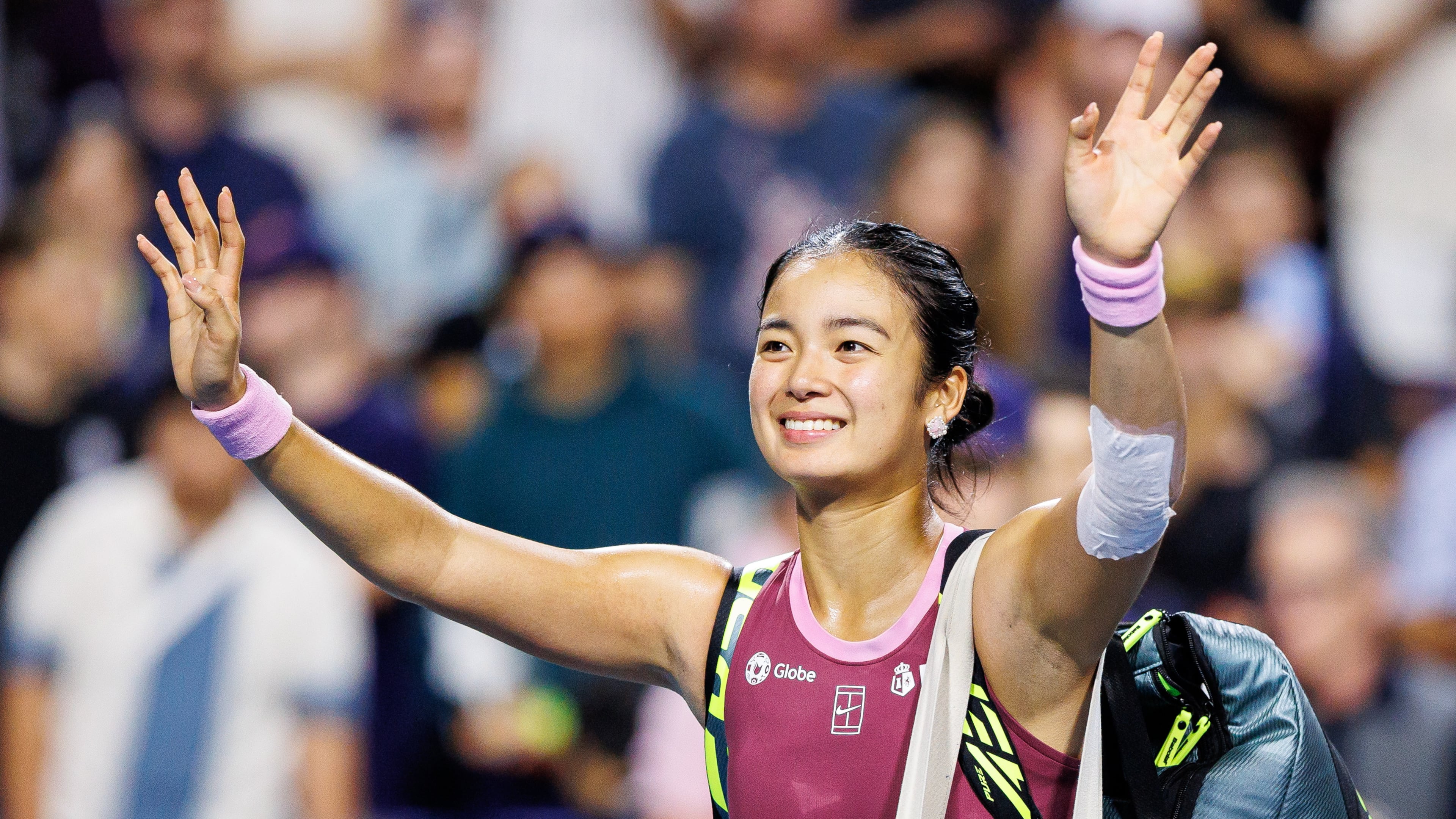 Alexandra Eala, of the Philippines, waves to the crowd after losing to Belinda Bencic, of Switzerland, in a round of 16 match at the National Bank Open tennis tournament in Toronto, on Sunday, Aug. 9, 2026. (Keito Newman/The Canadian Press via AP)