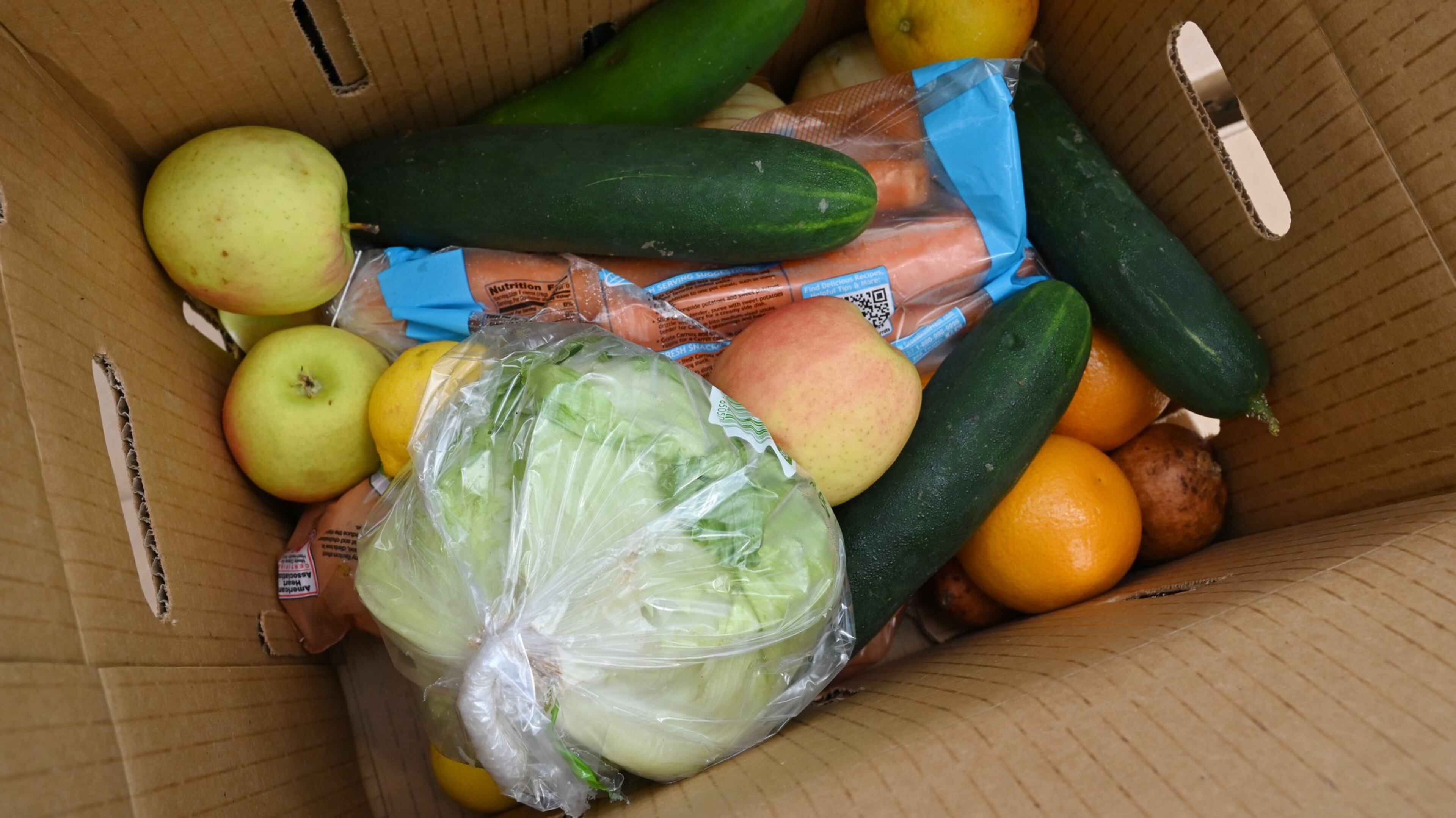 Officials and volunteers handed out fresh food to residents at a recent food distribution event in DeKalb County.